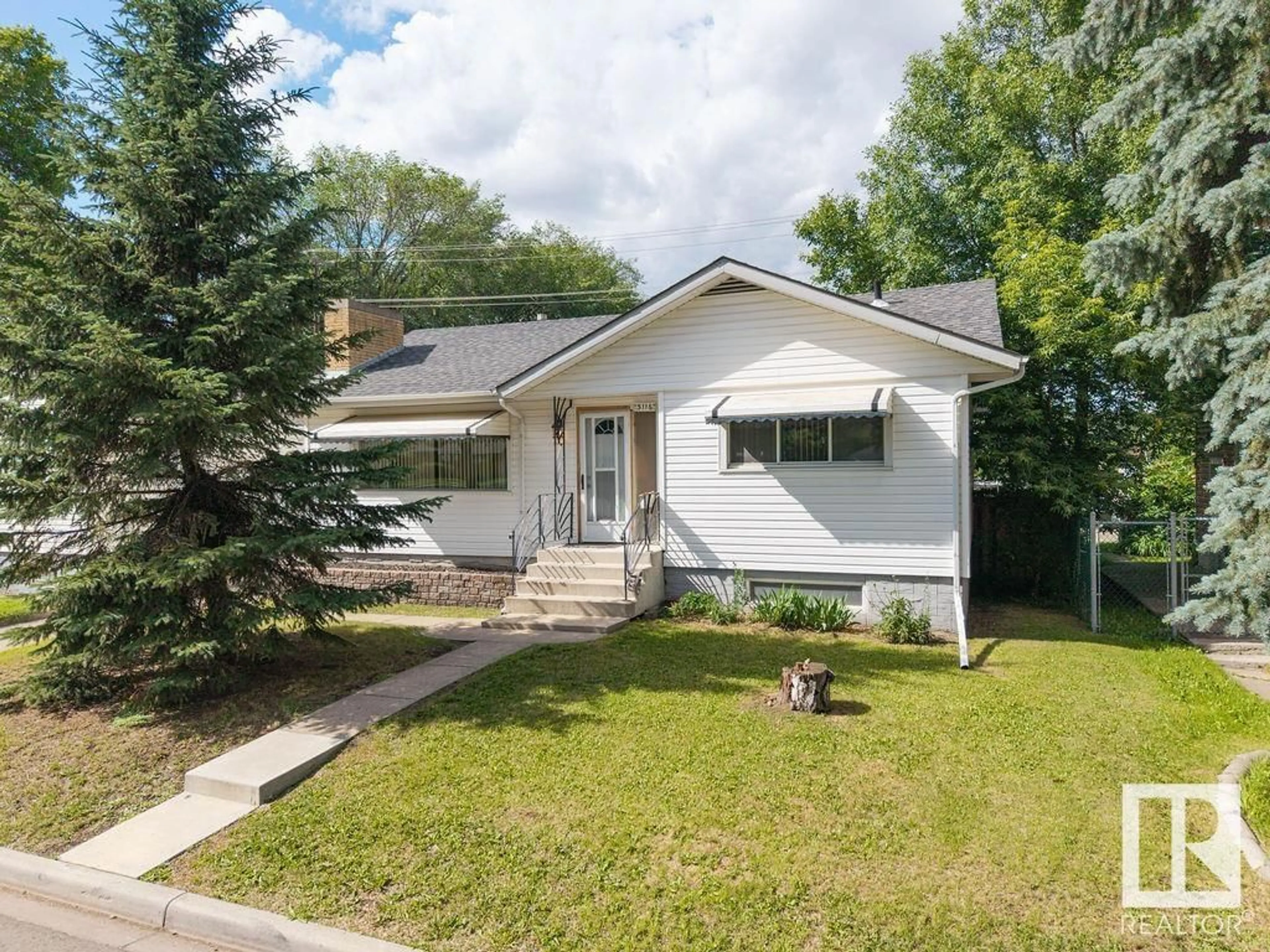 Home with vinyl exterior material, street for NW - 5116 118 AV, Edmonton Alberta T5W1B9