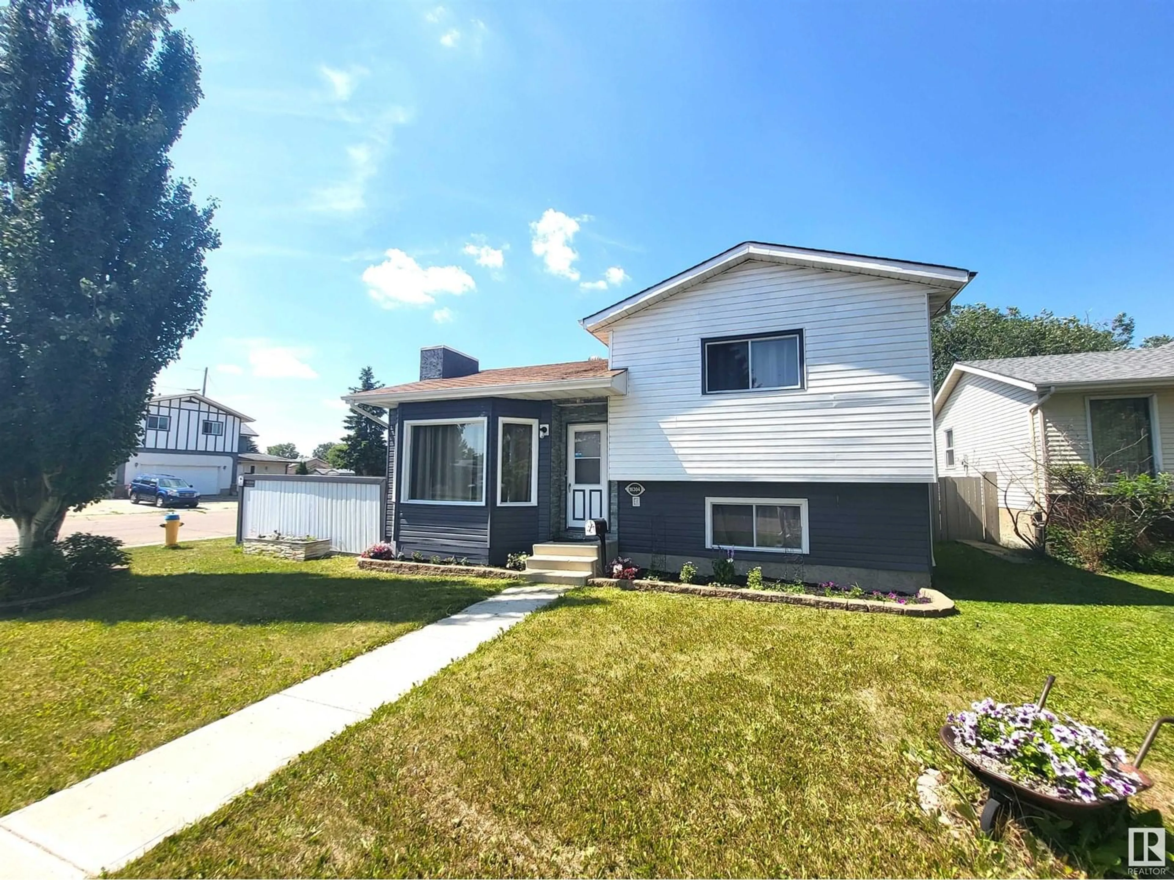 Home with vinyl exterior material, street for NW - 16304 119 ST, Edmonton Alberta T5X4T5