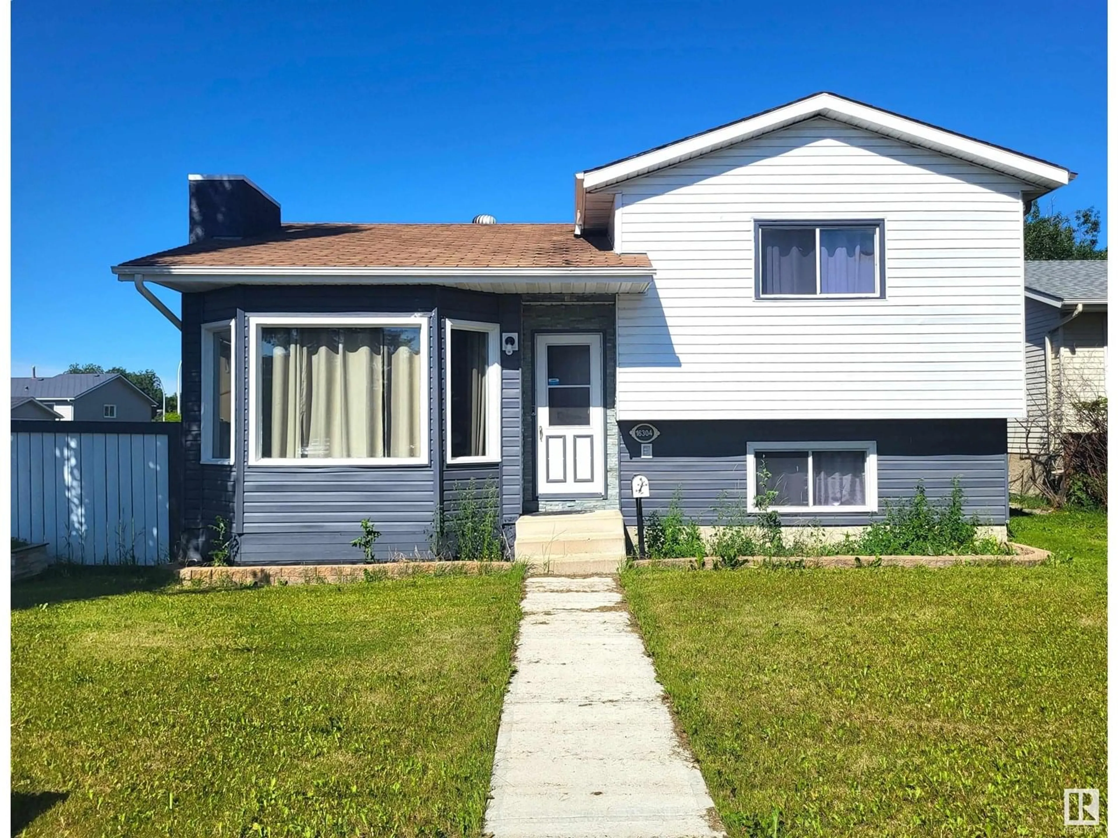 Home with vinyl exterior material, street for NW - 16304 119 ST, Edmonton Alberta T5X4T5
