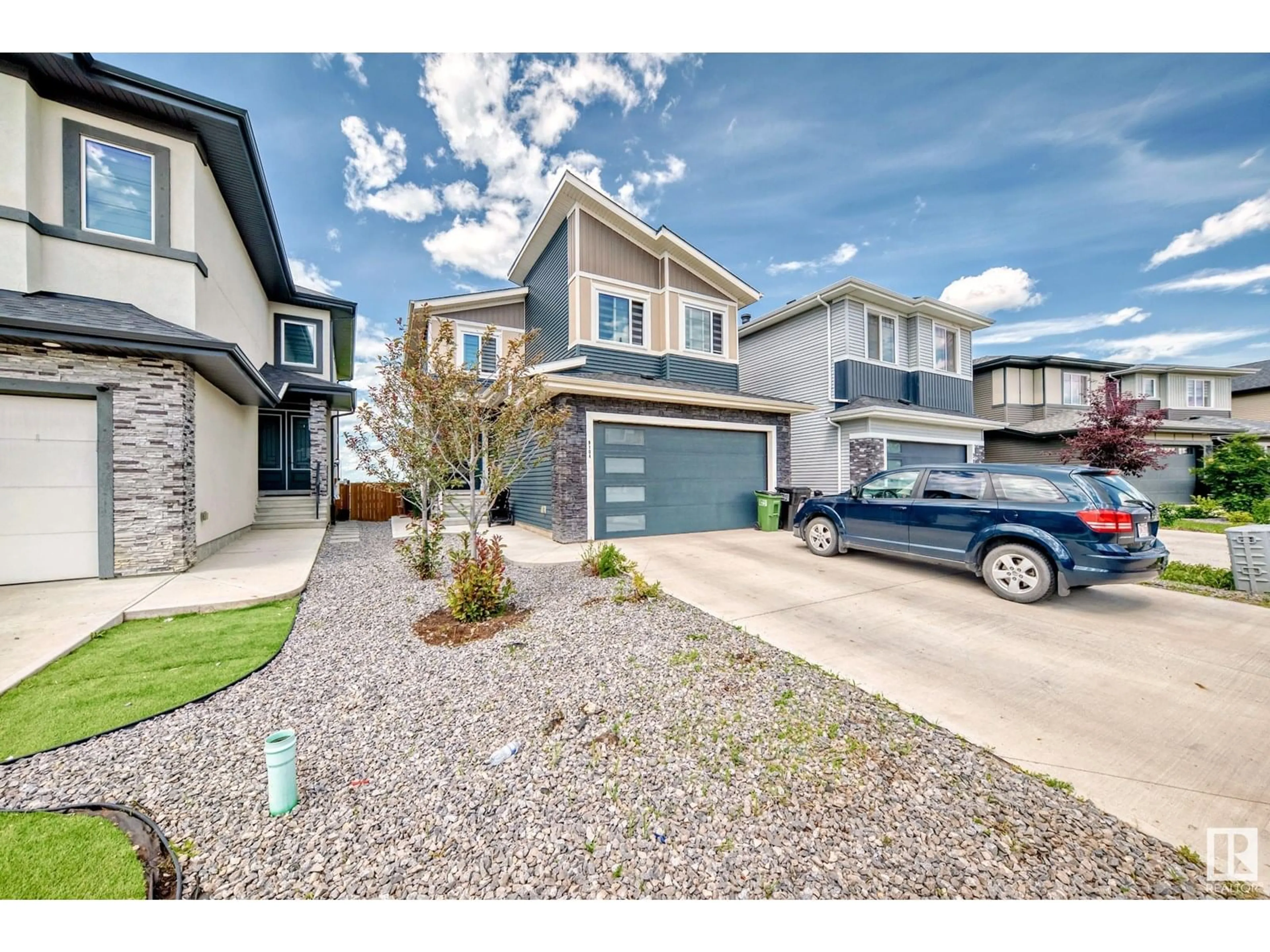 Home with vinyl exterior material, street for NW - 9104 183 AV, Edmonton Alberta T5Z0S6