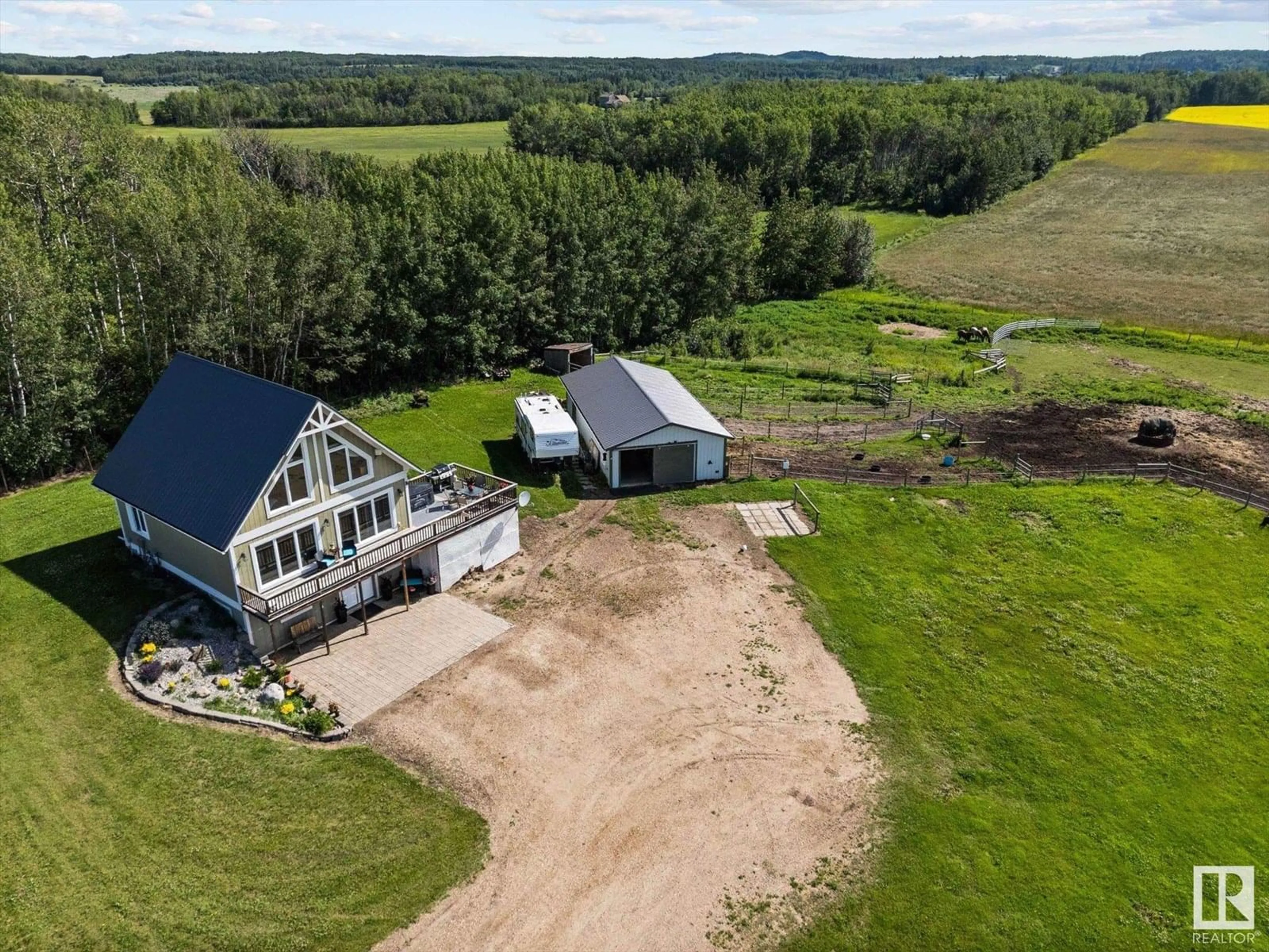 A pic from outside/outdoor area/front of a property/back of a property/a pic from drone, unknown for 56015 RGE RD 13, Rural Lac Ste. Anne County Alberta T0E1V0