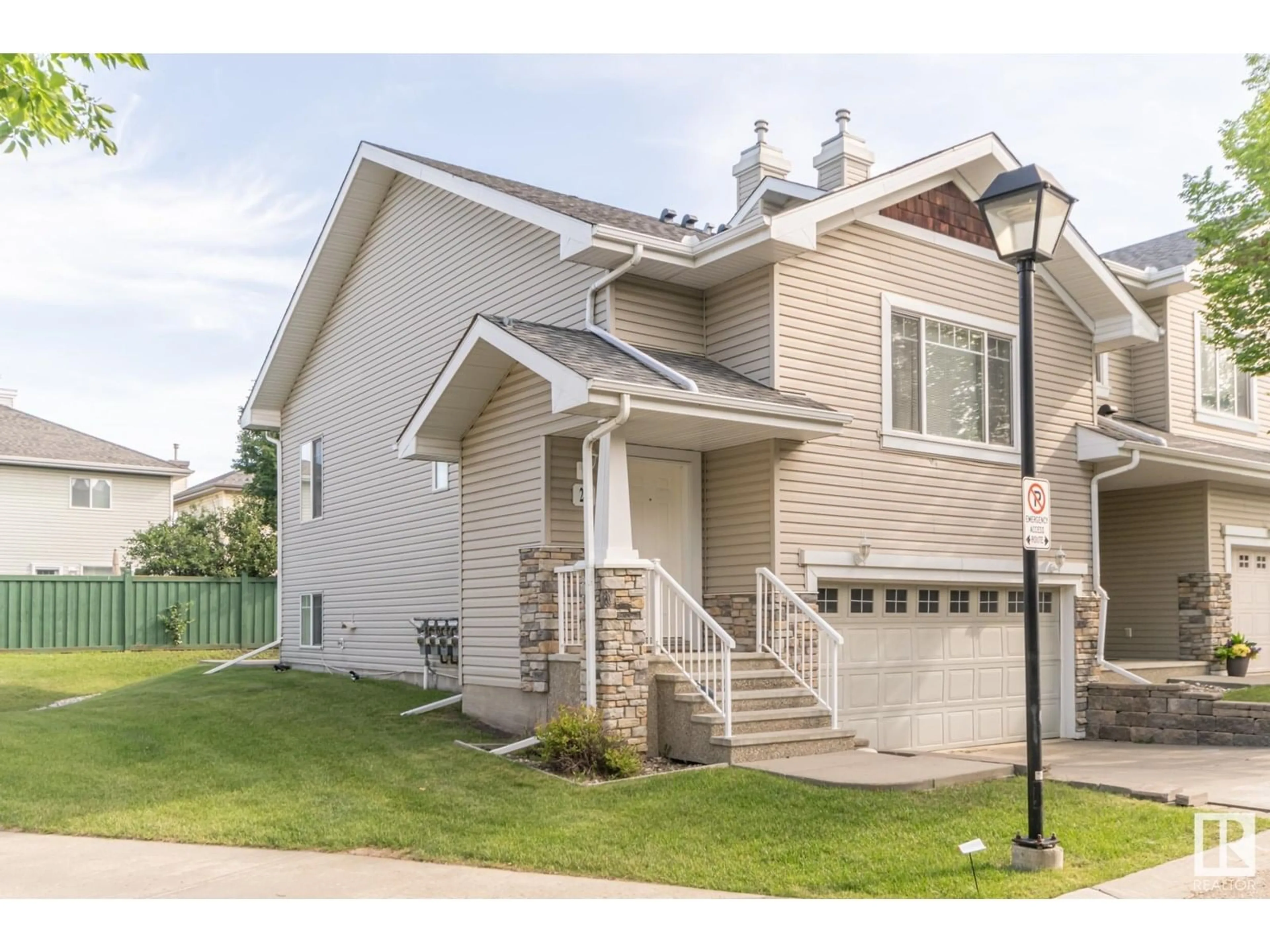 Home with vinyl exterior material, street for #18 - 2508 HANNA CR, Edmonton Alberta T6R3N7