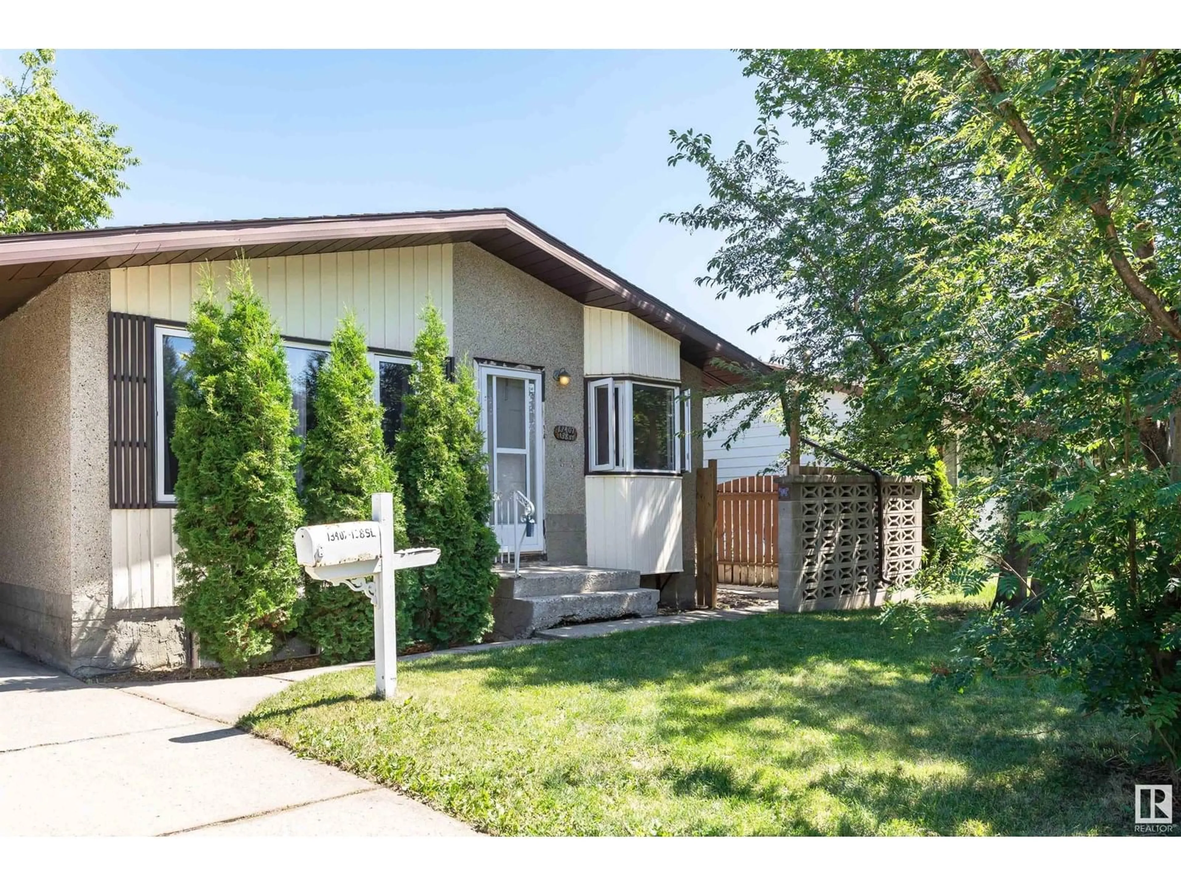 Home with vinyl exterior material, street for NW - 13407 138 ST, Edmonton Alberta T5L2C3