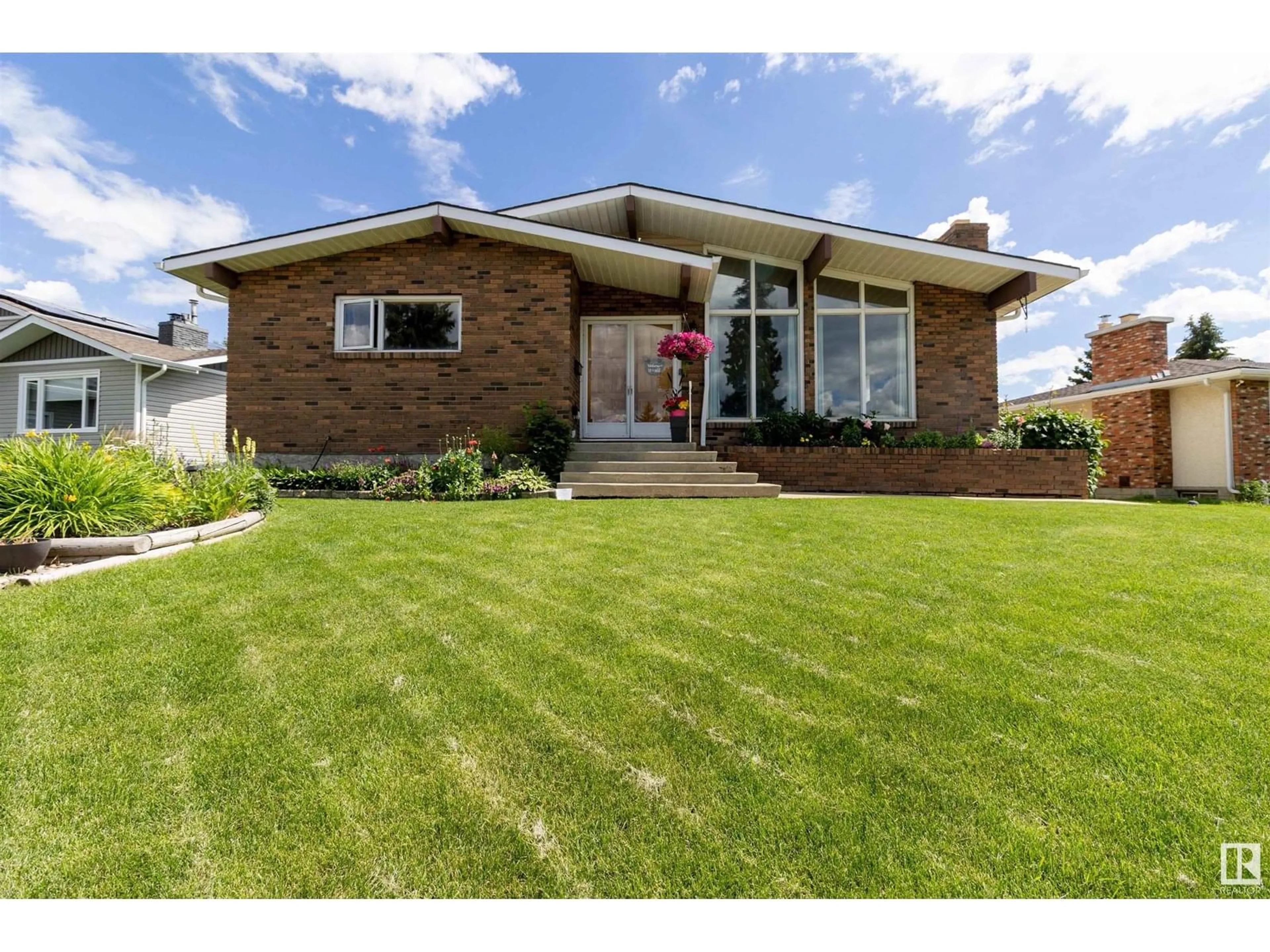 Home with brick exterior material, street for NW - 1303 85 ST, Edmonton Alberta T6K1X7