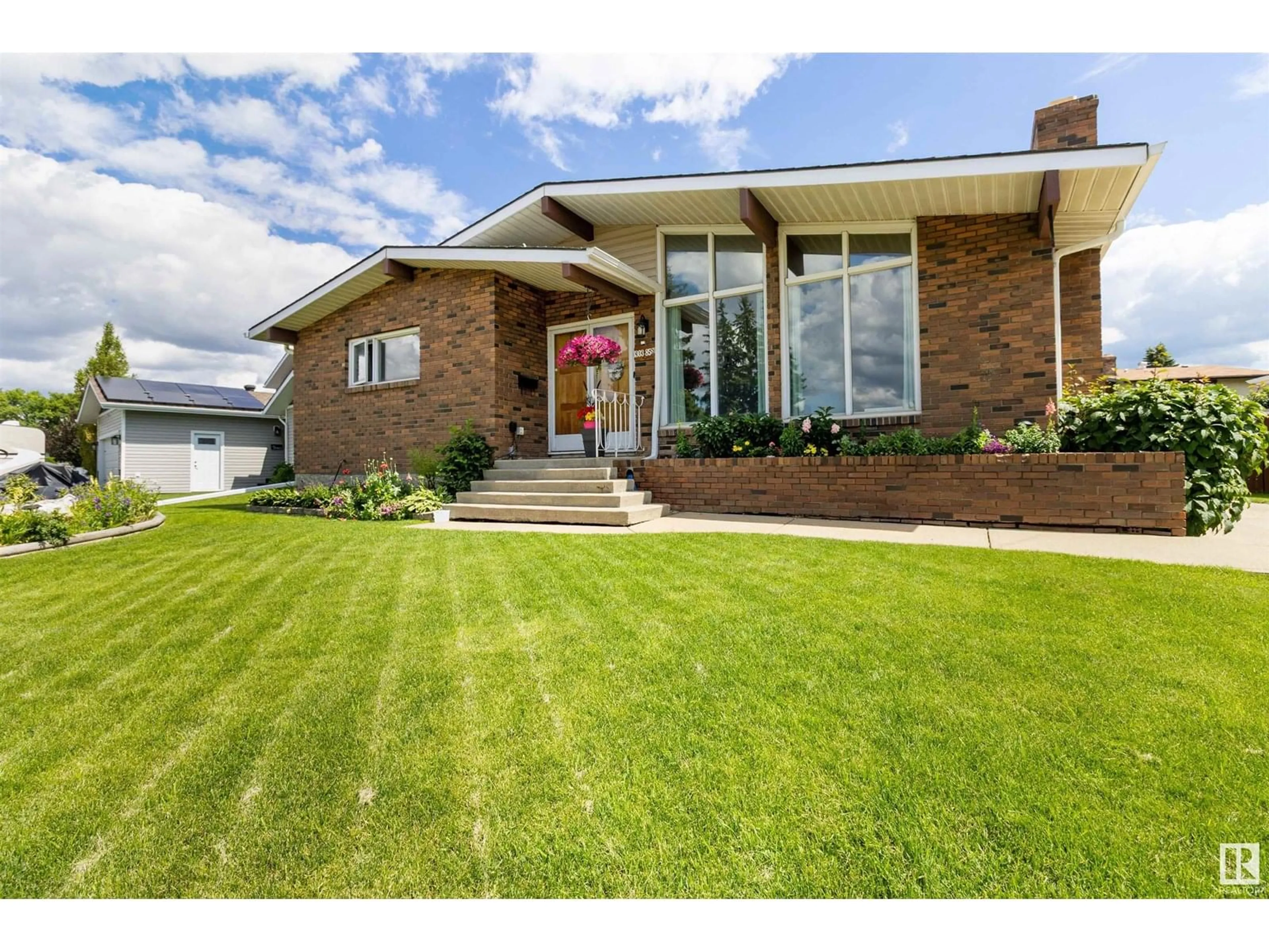 Home with brick exterior material, street for NW - 1303 85 ST, Edmonton Alberta T6K1X7