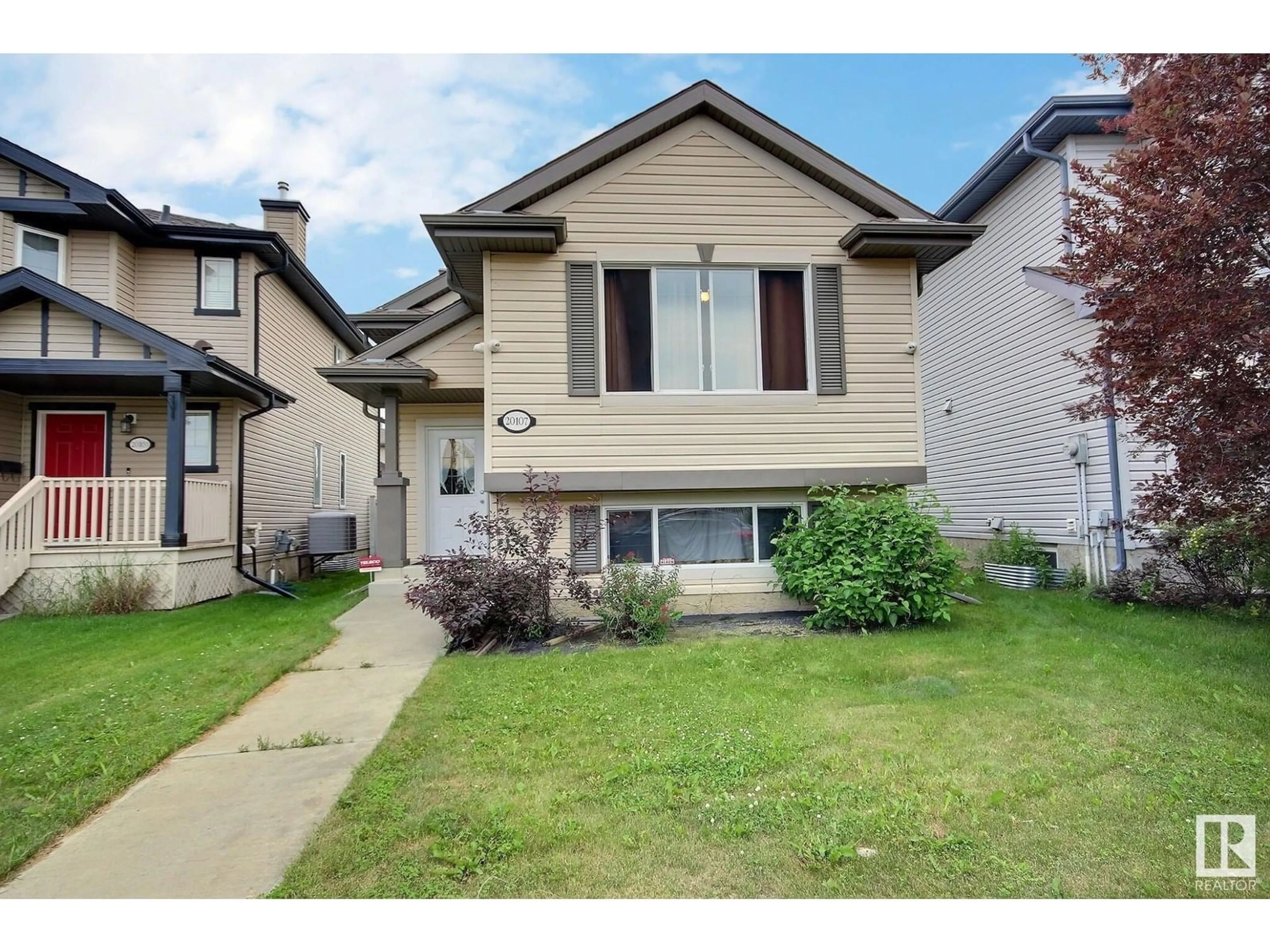Home with vinyl exterior material, street for 20107 58 AV, Edmonton Alberta T6M0B4