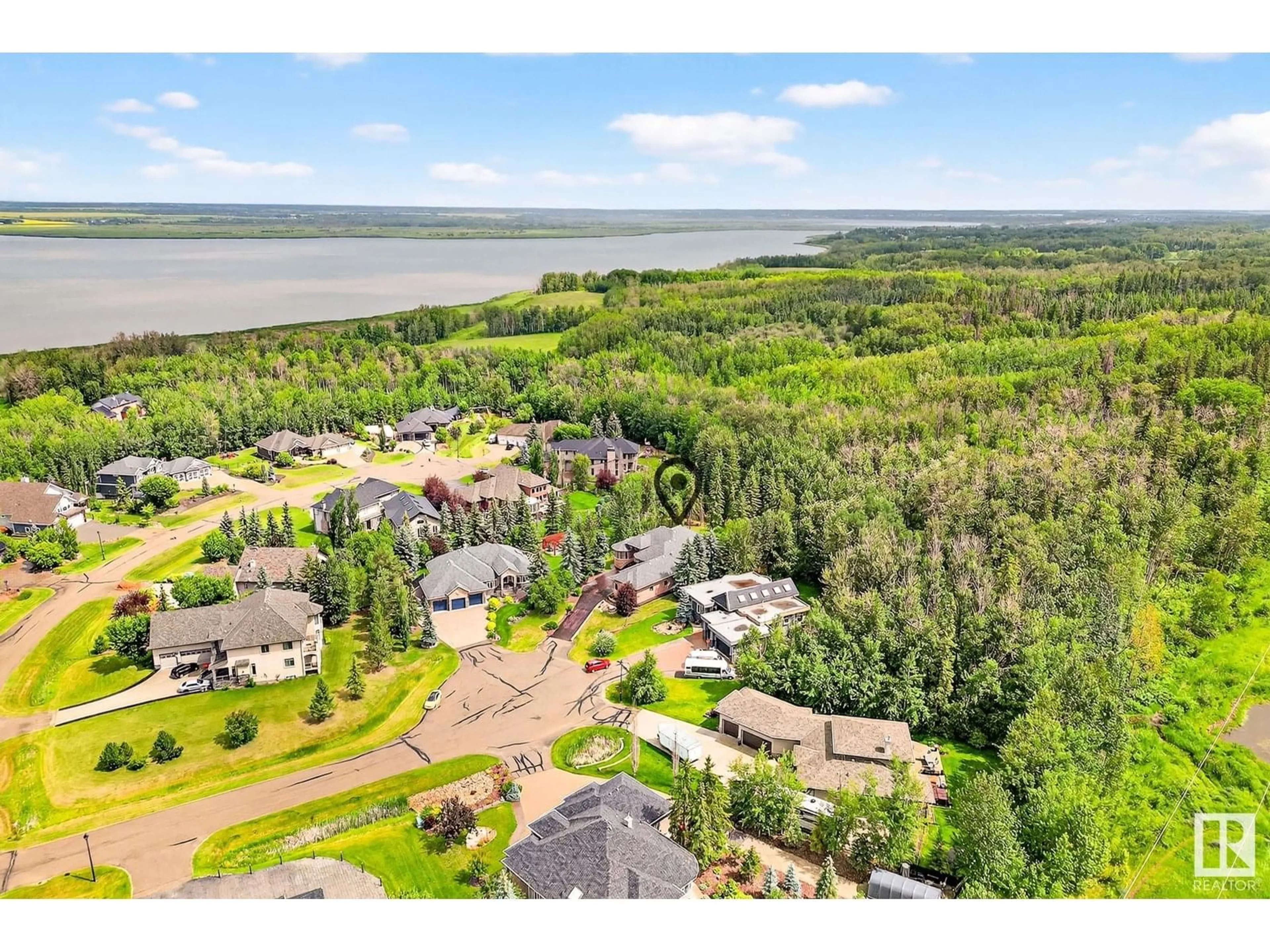 A pic from outside/outdoor area/front of a property/back of a property/a pic from drone, water/lake/river/ocean view for 61 53217 RGE ROAD 263, Rural Parkland County Alberta T7X3G2