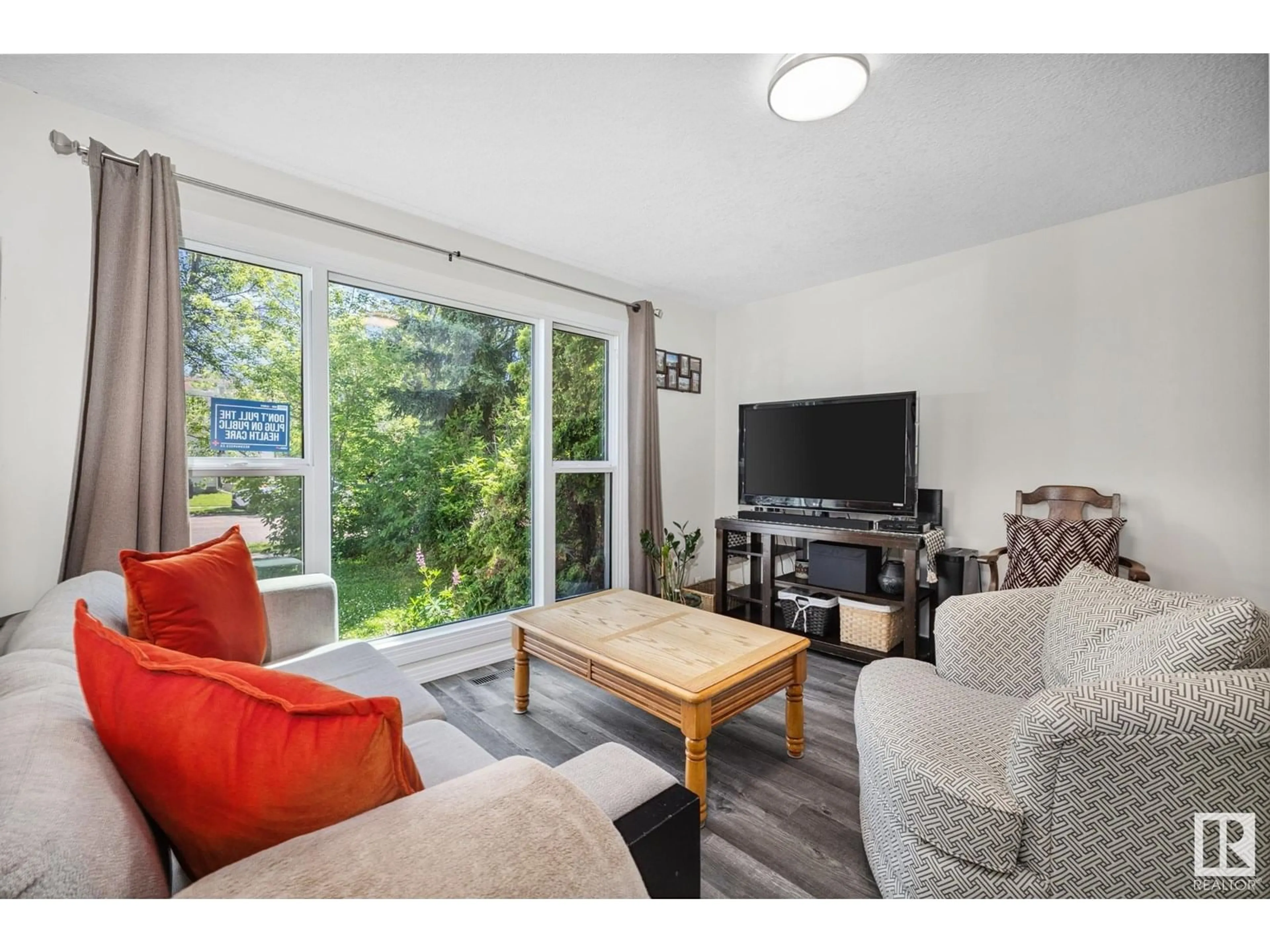 Living room with furniture, wood/laminate floor for 4 WAVERLY DR, St. Albert Alberta T8N3N4