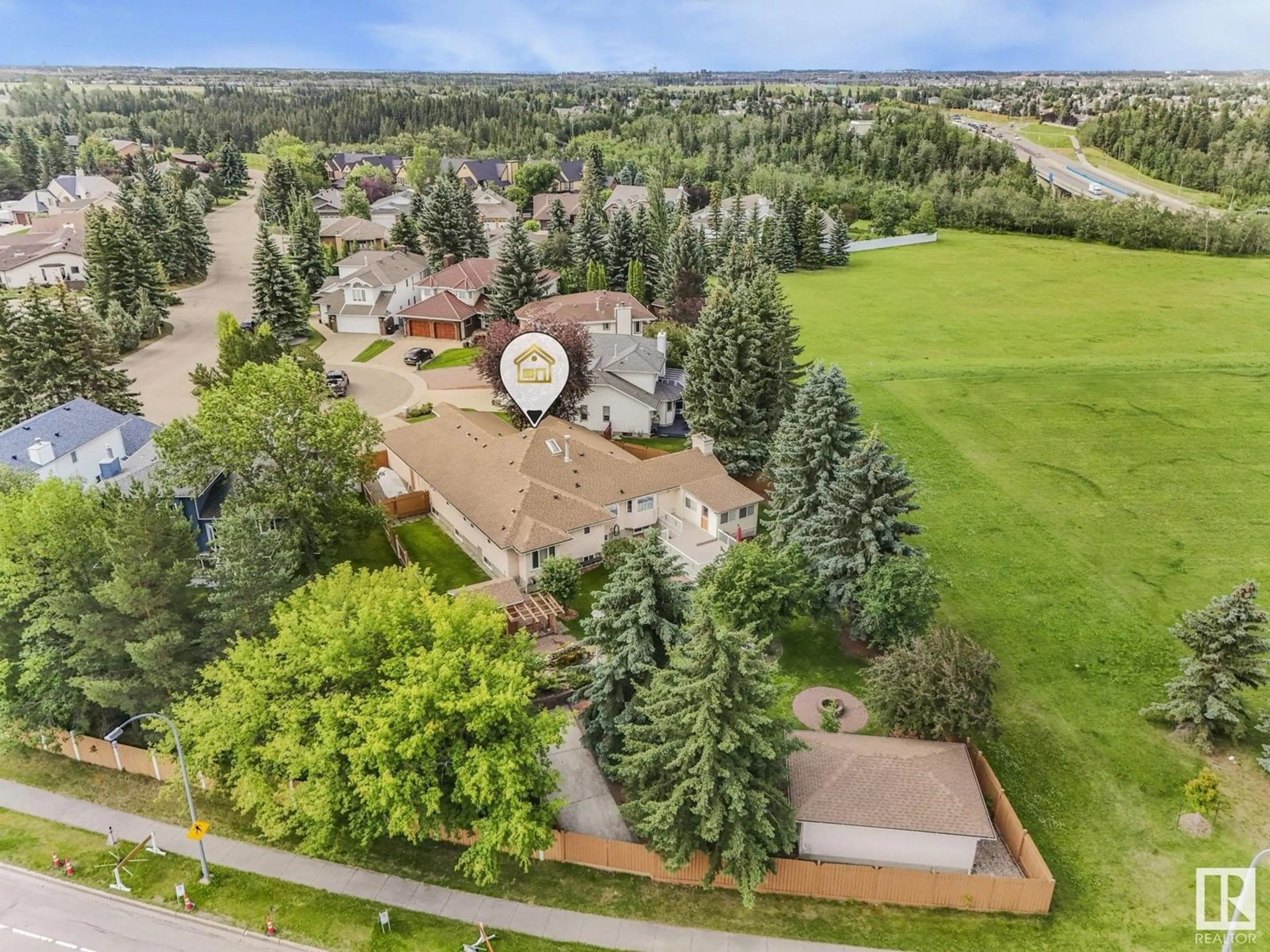 A pic from outside/outdoor area/front of a property/back of a property/a pic from drone, mountain view for 1820 BEARSPAW RD, Edmonton Alberta T6J6K4