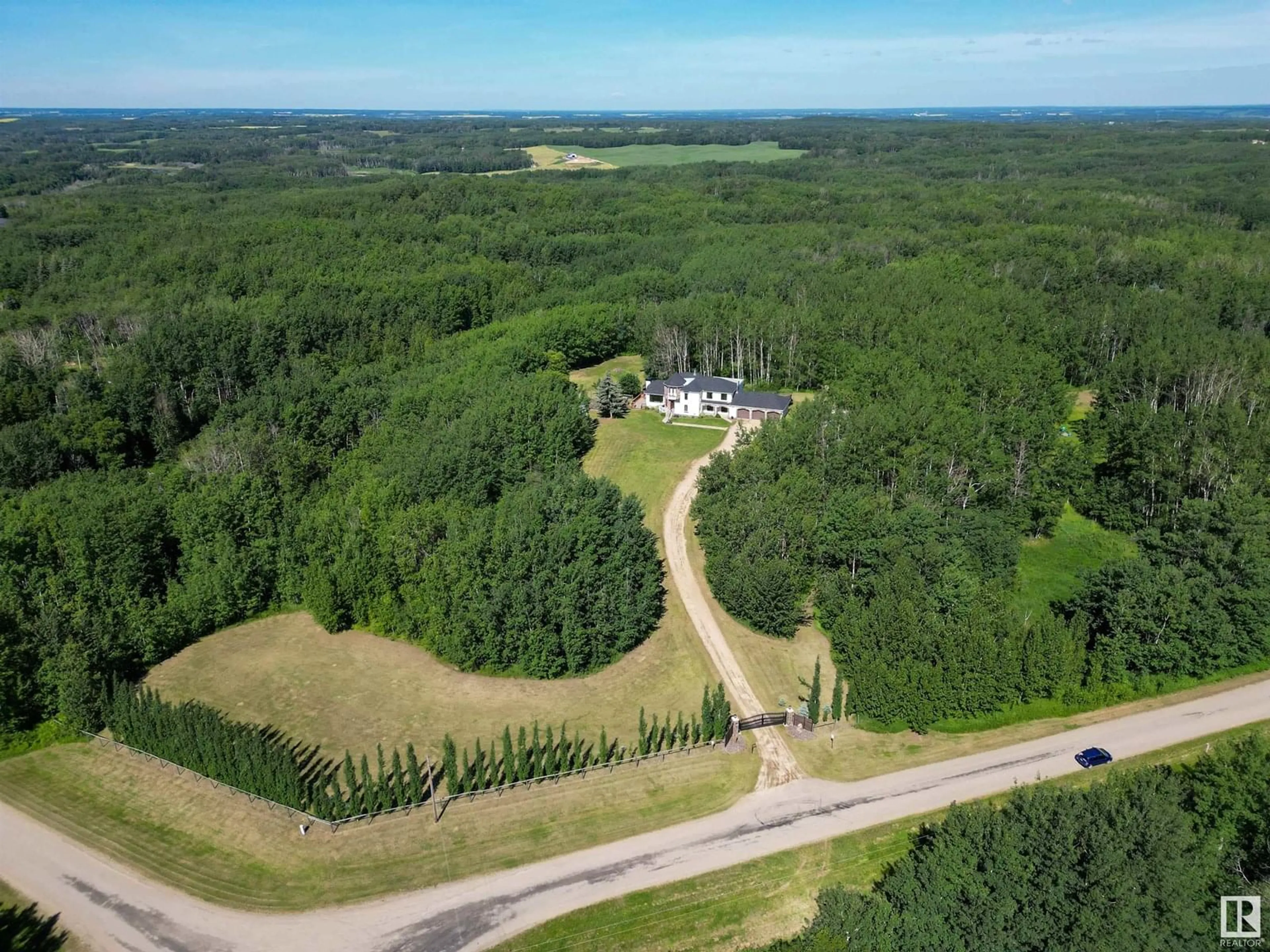 A pic from outside/outdoor area/front of a property/back of a property/a pic from drone, forest/trees view for 54020 - 25 HGHWAY 779, Rural Parkland County Alberta T7Y0A3