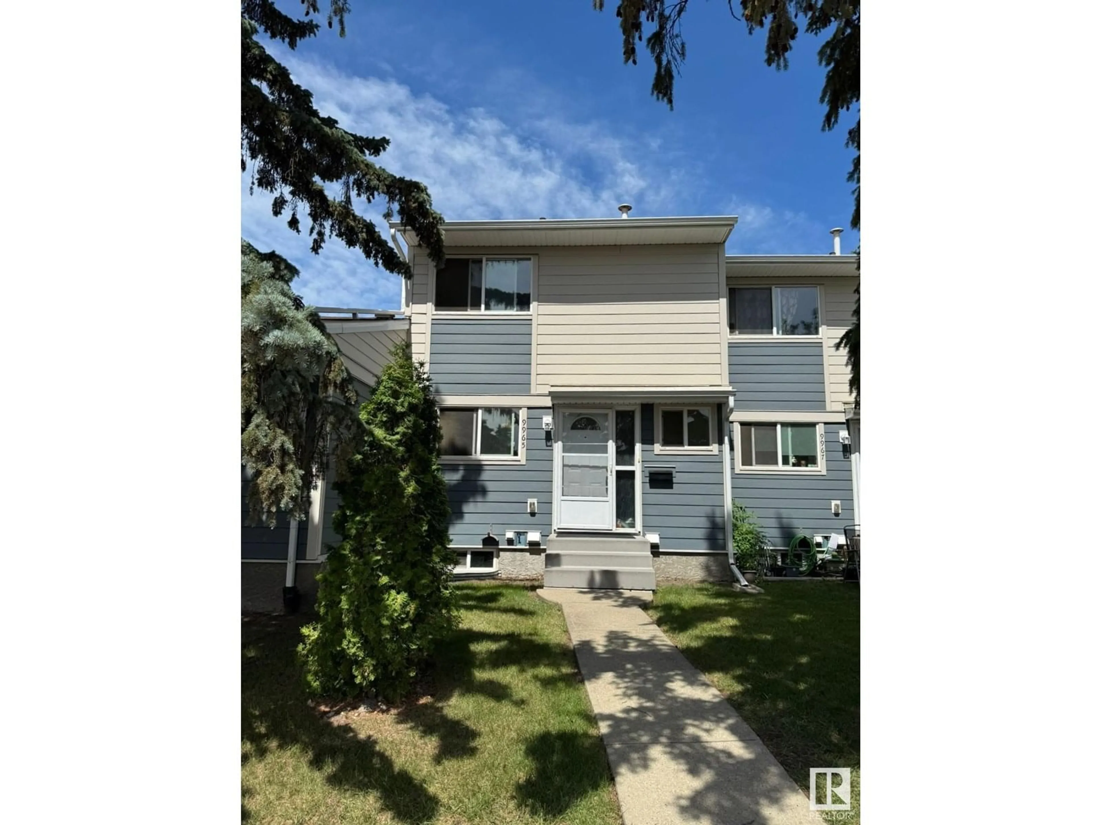 Home with vinyl exterior material, street for 9965 171 AV, Edmonton Alberta T5X4X2