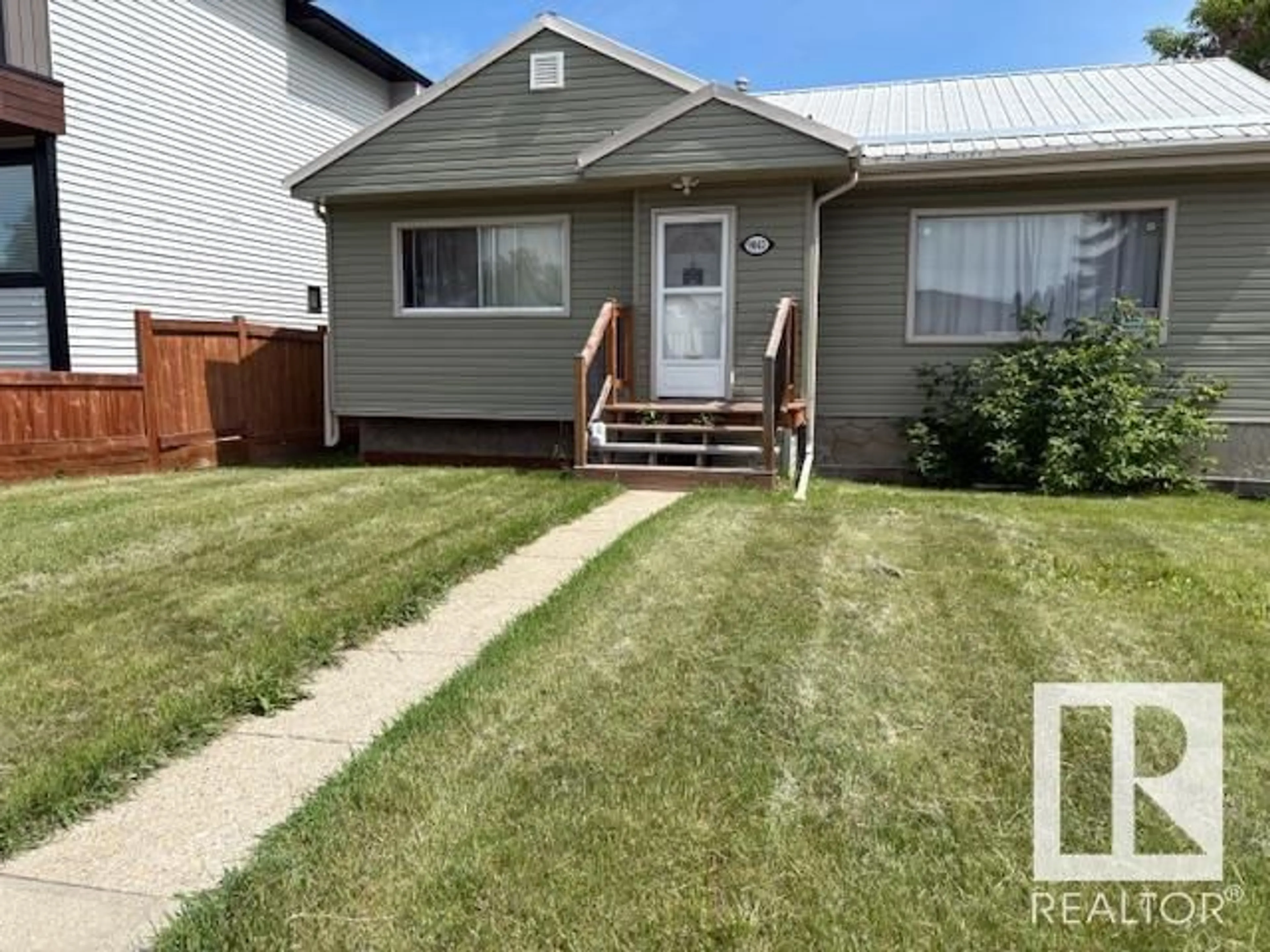Home with vinyl exterior material, street for NW - 9041 151 ST, Edmonton Alberta T5R1J4