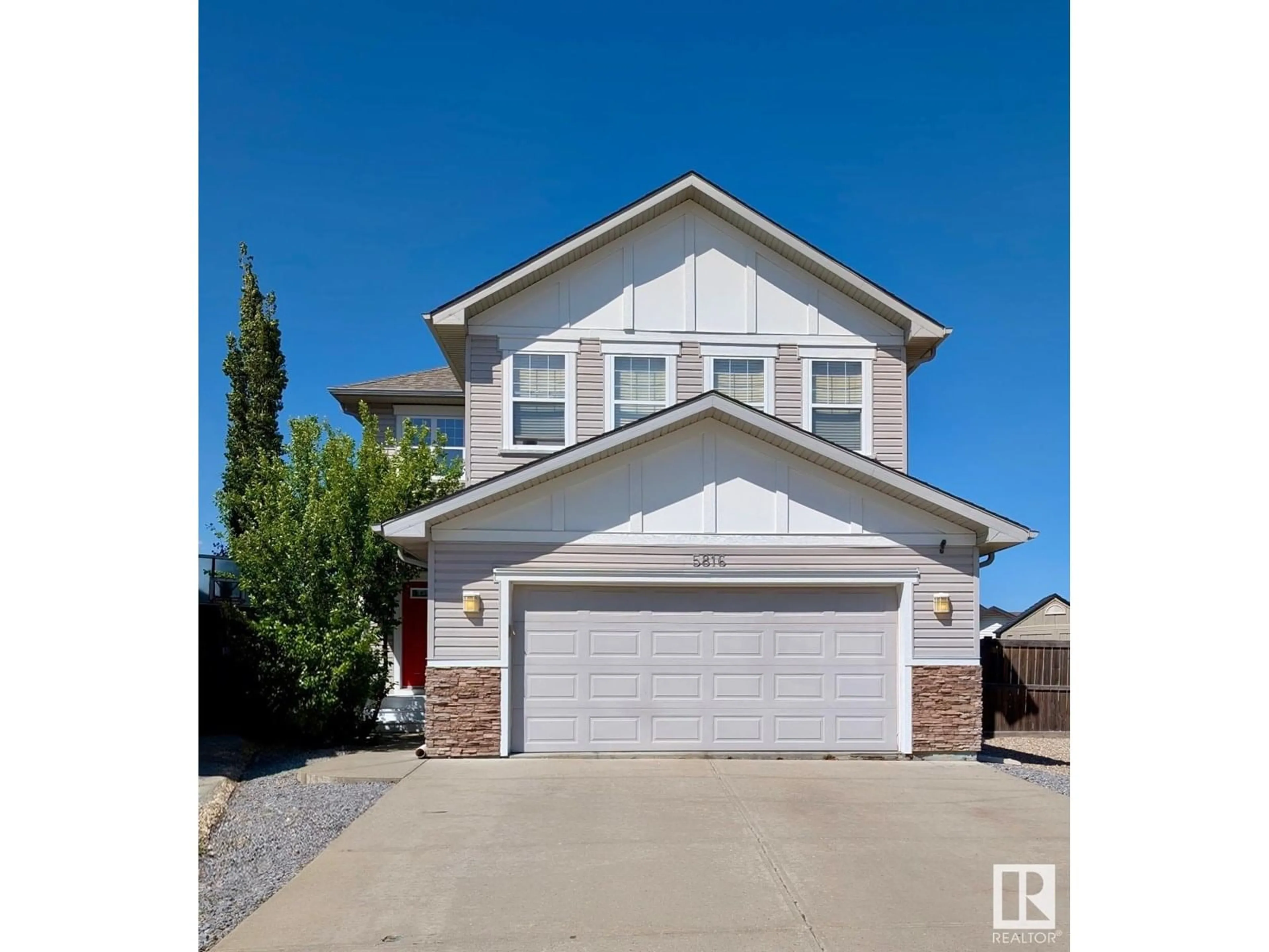 Home with vinyl exterior material, street for 5816 168 AV, Edmonton Alberta T5Y0K6