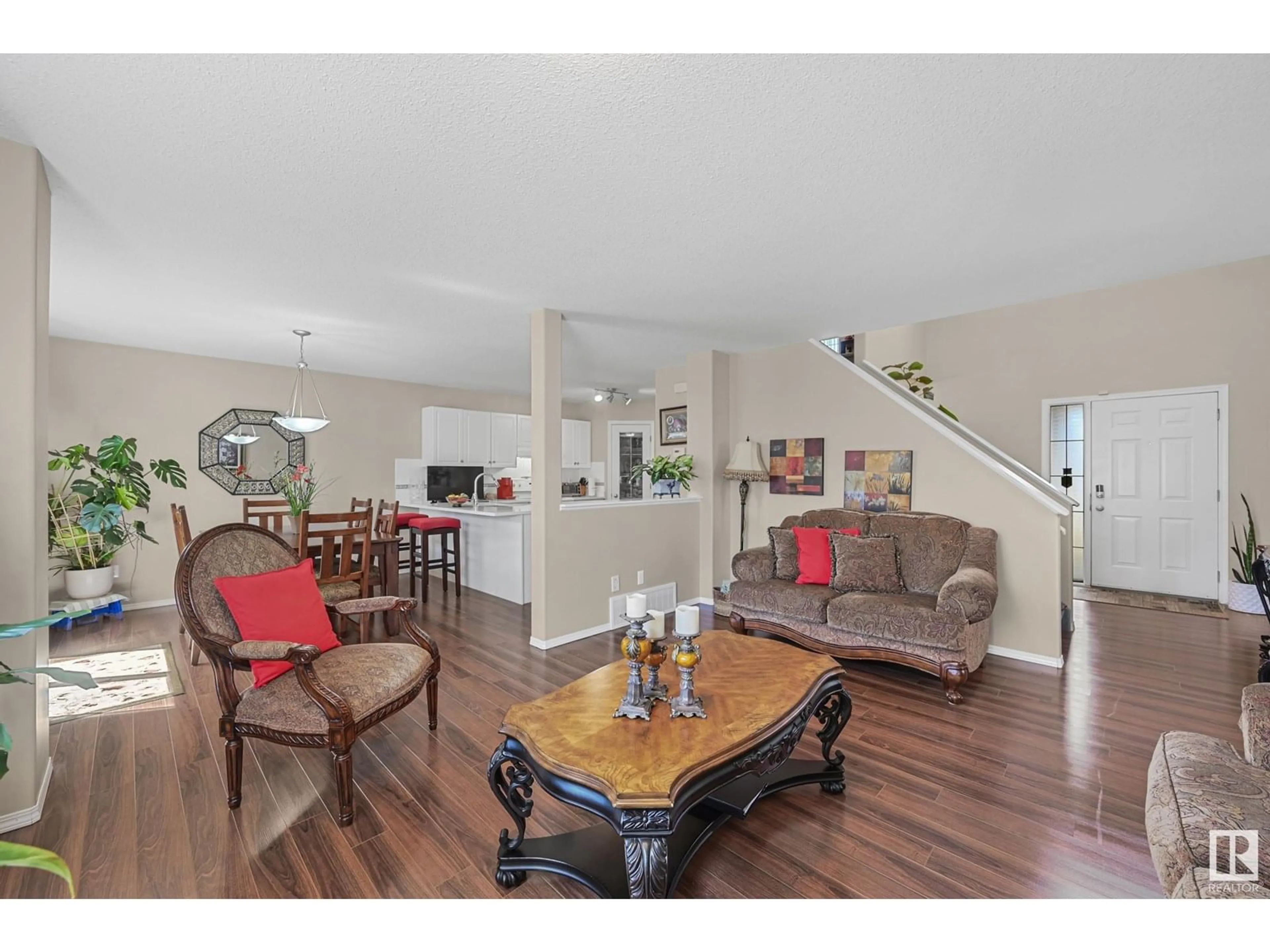 Living room with furniture, wood/laminate floor for 3371 25 AV, Edmonton Alberta T6T1Y4