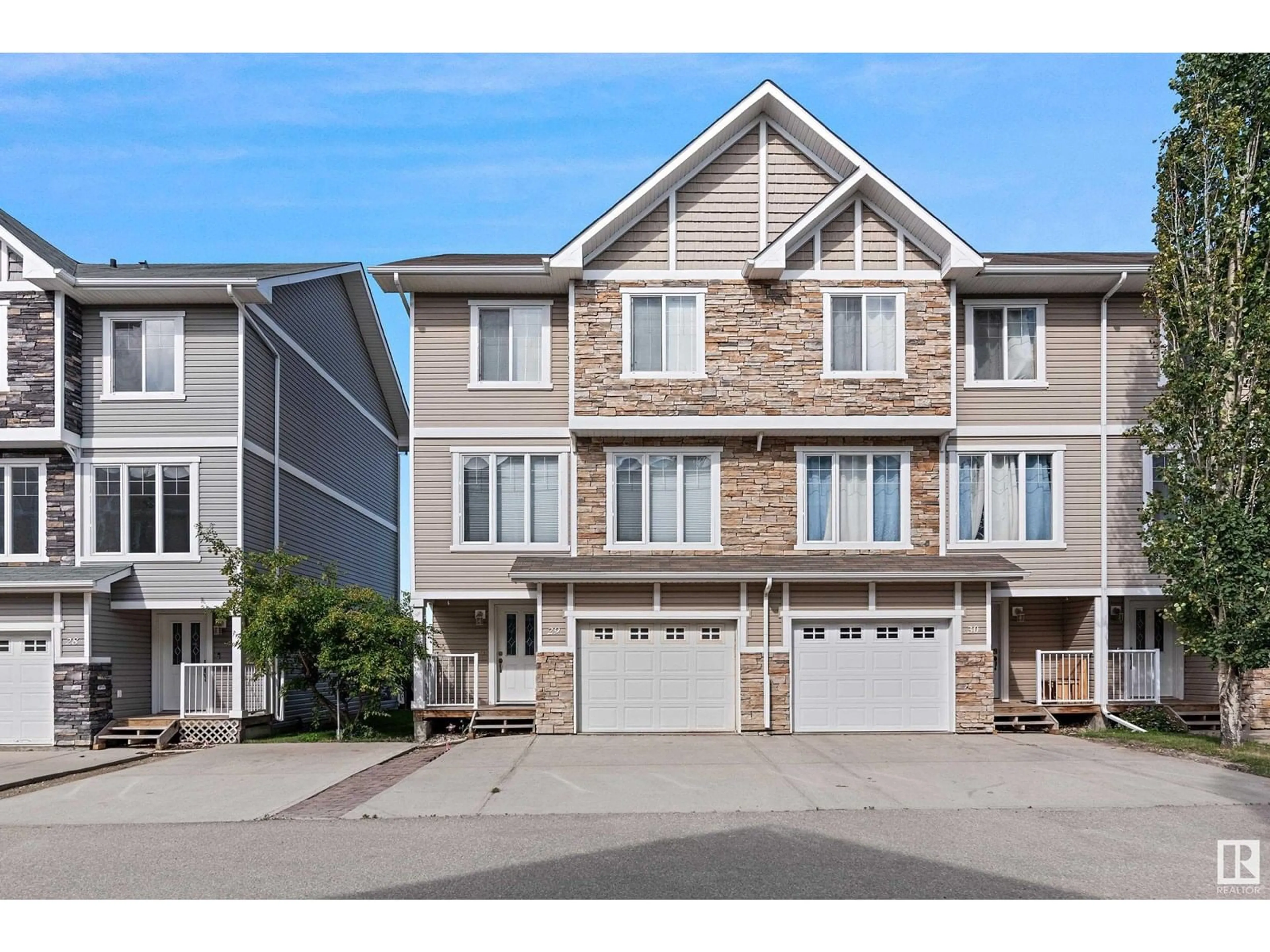 Home with vinyl exterior material, street for 29 9904 101 AV, Morinville Alberta T8R0E2