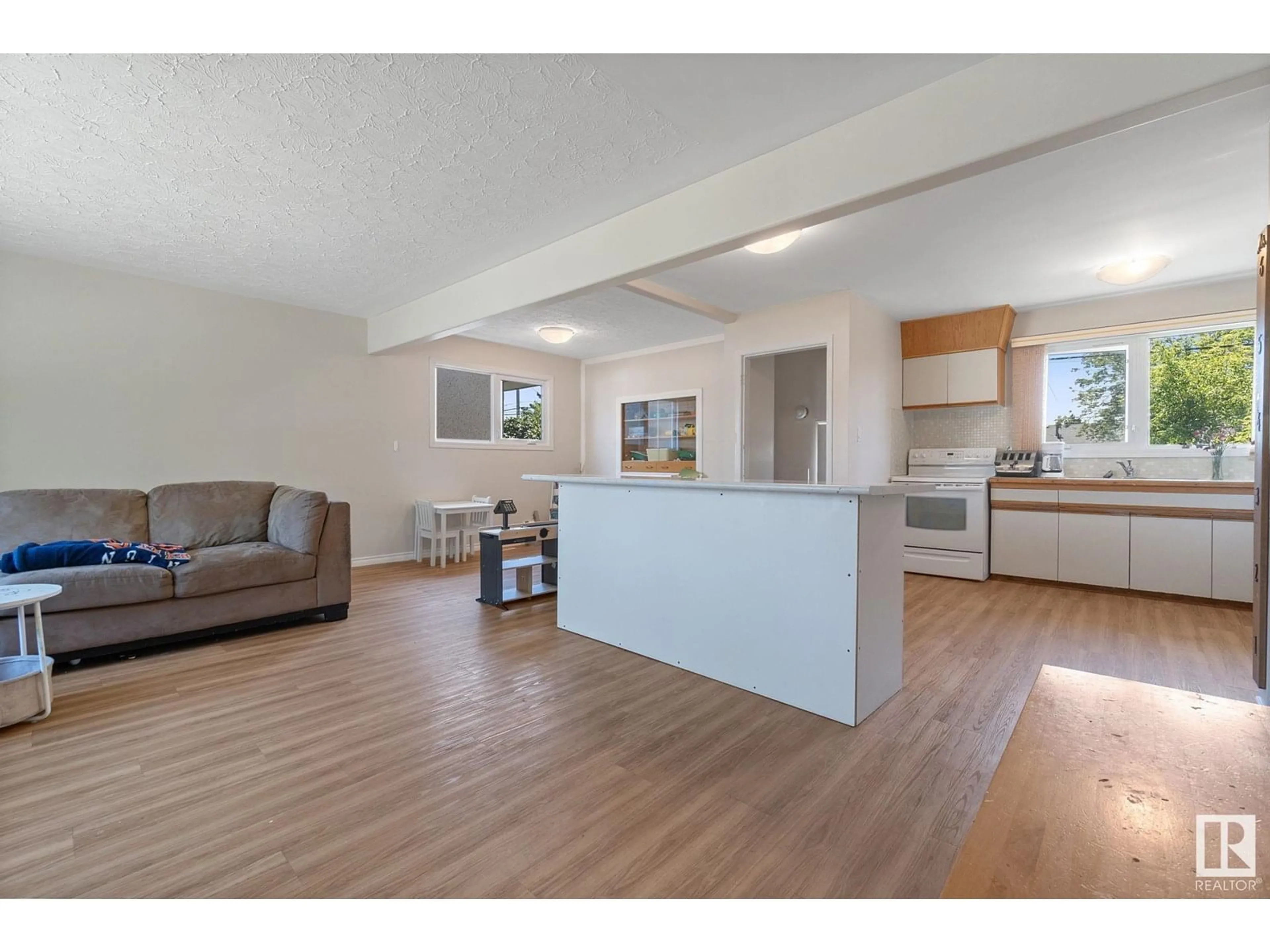 Open concept kitchen, wood/laminate floor for 10523 137 AV, Edmonton Alberta T5E1Z1