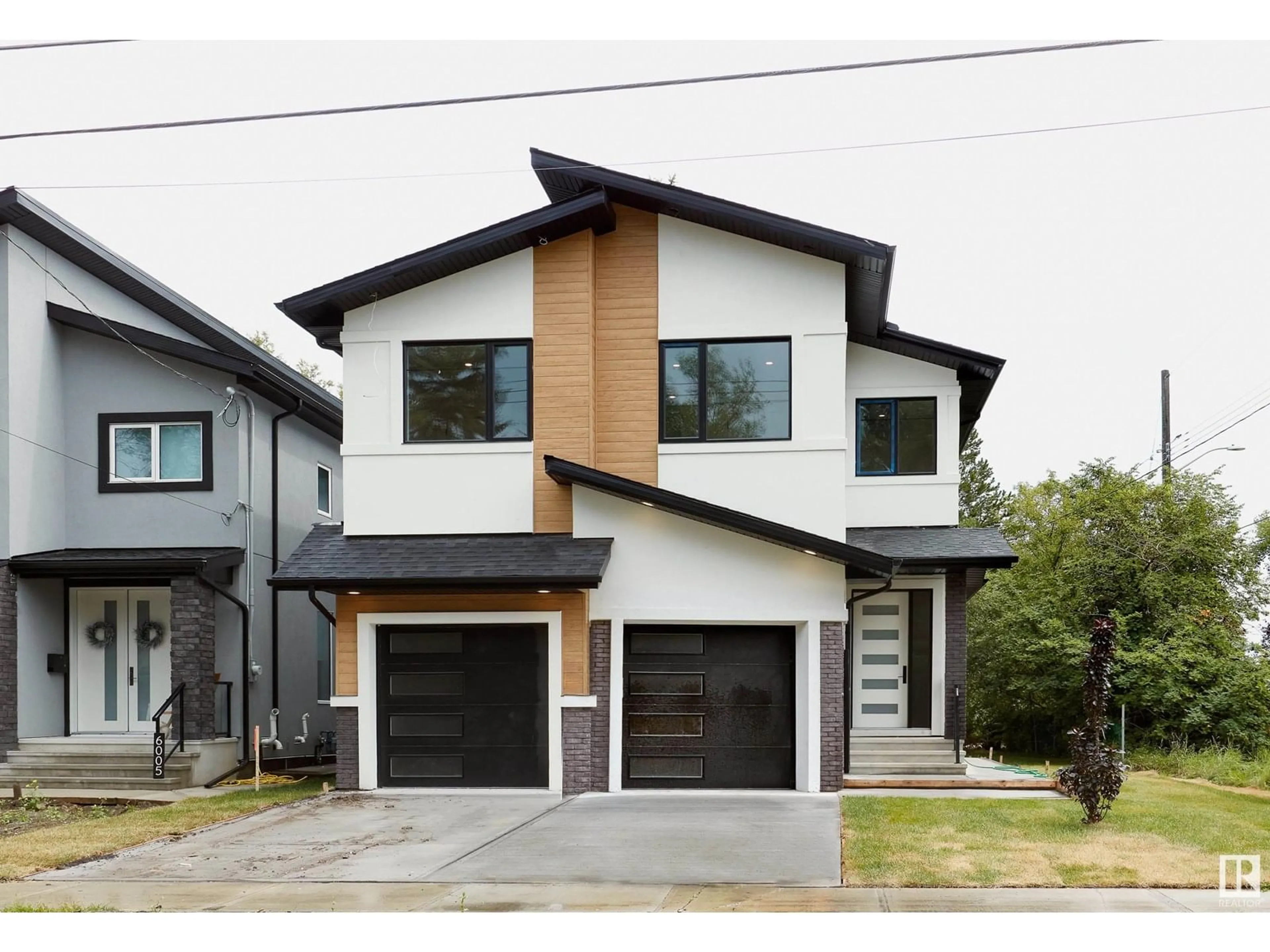 Home with vinyl exterior material, street for NW - 6003 107 ST, Edmonton Alberta T6H2X9