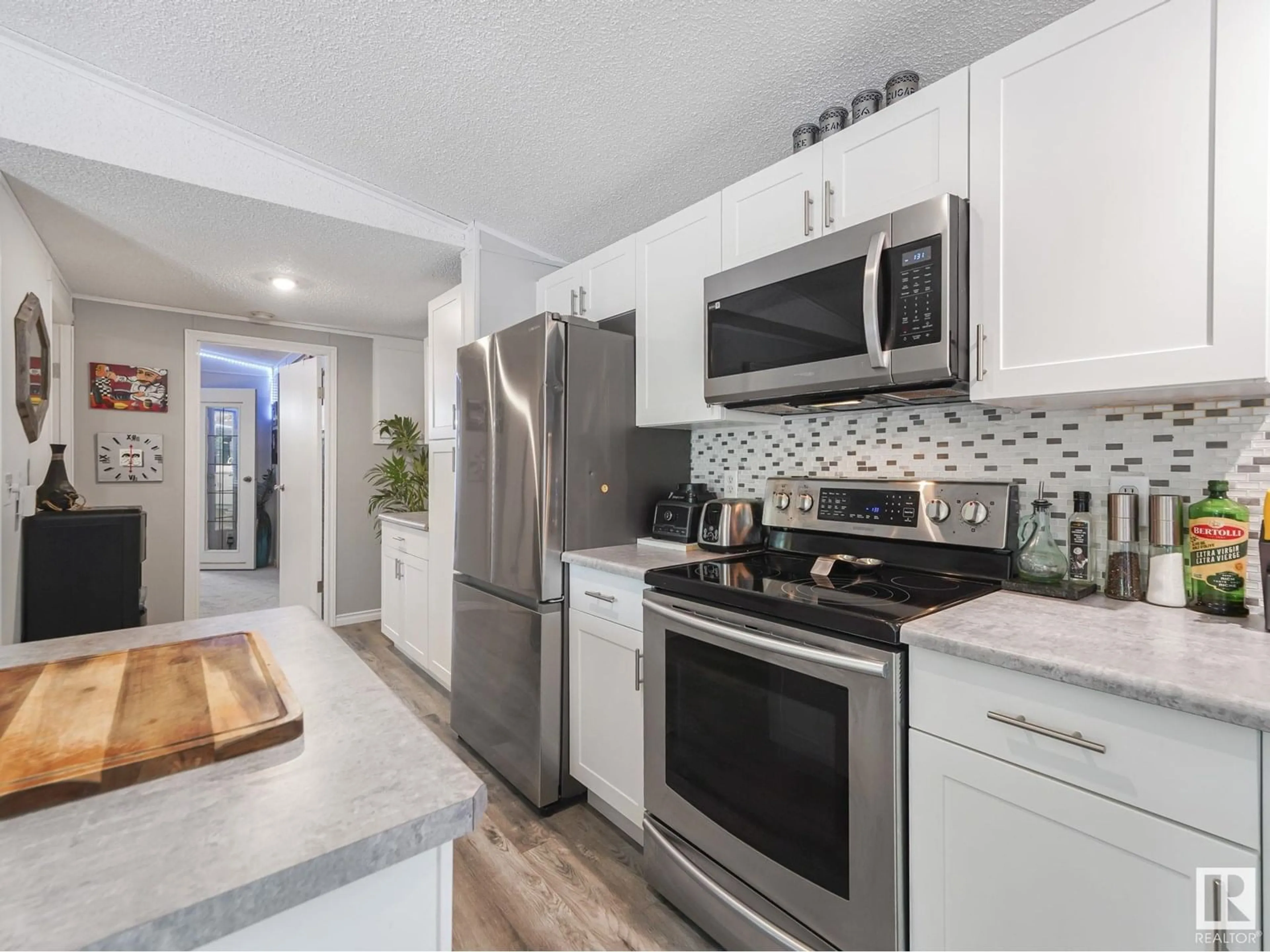 Open concept kitchen, ceramic/tile floor for 304 57323 RGRD 30, Rural Barrhead County Alberta T7N1N4