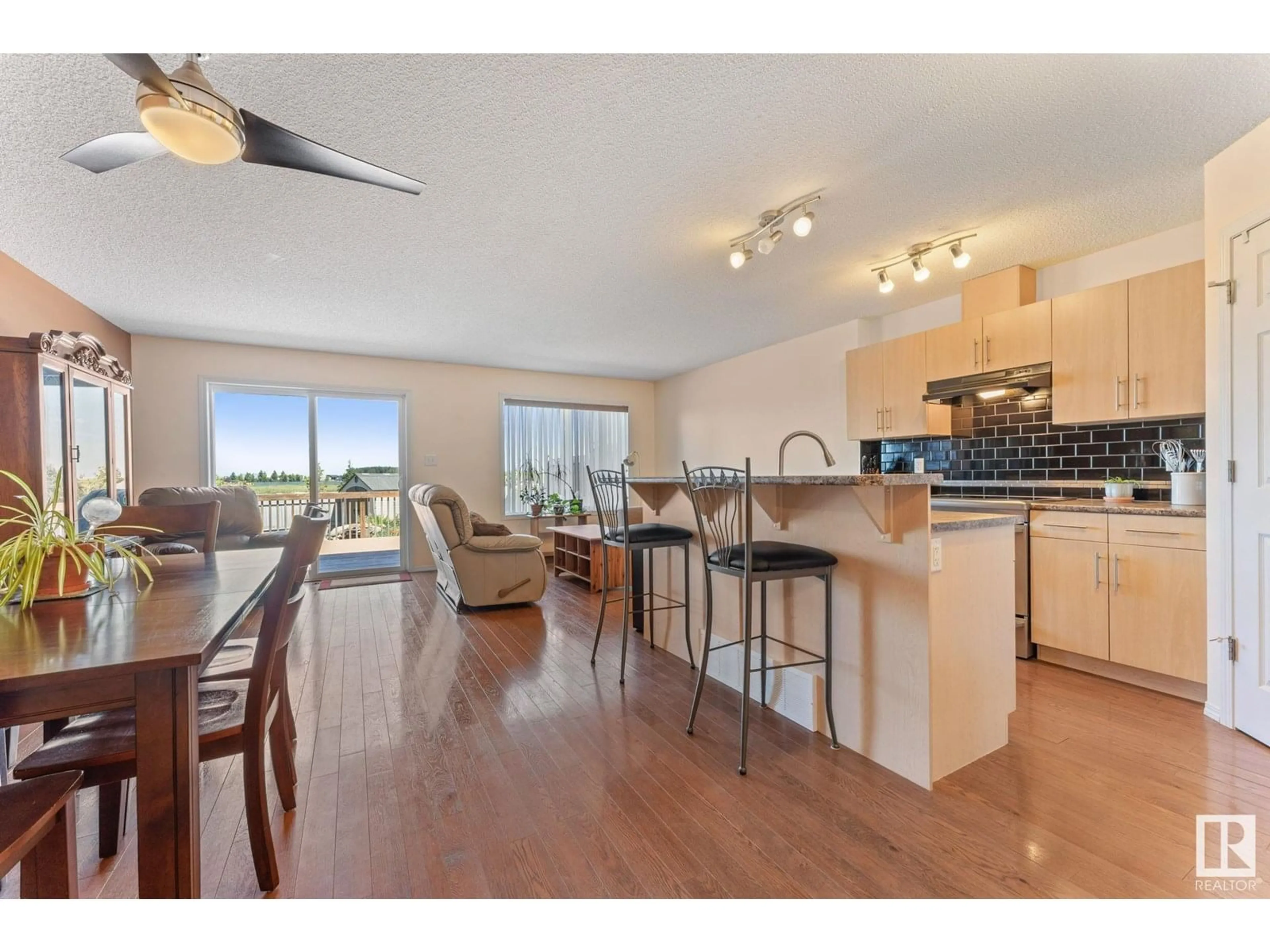 Open concept kitchen, wood/laminate floor for 21306 61 AV, Edmonton Alberta T6M0J9