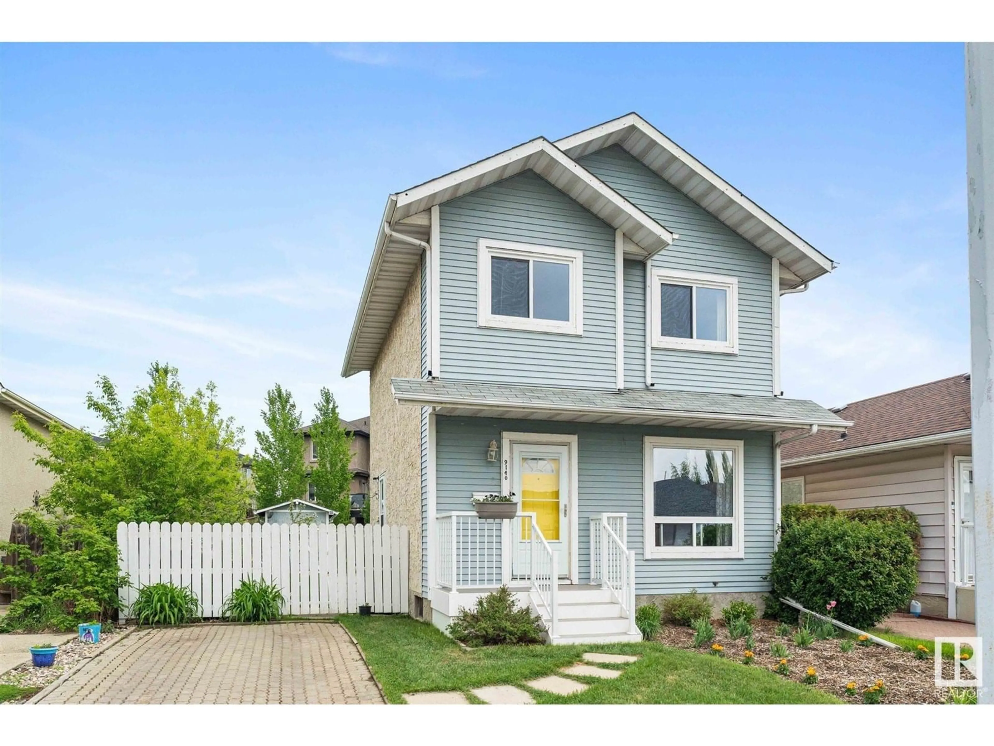 Home with vinyl exterior material, street for 9140 180A AV, Edmonton Alberta T5Z2K2