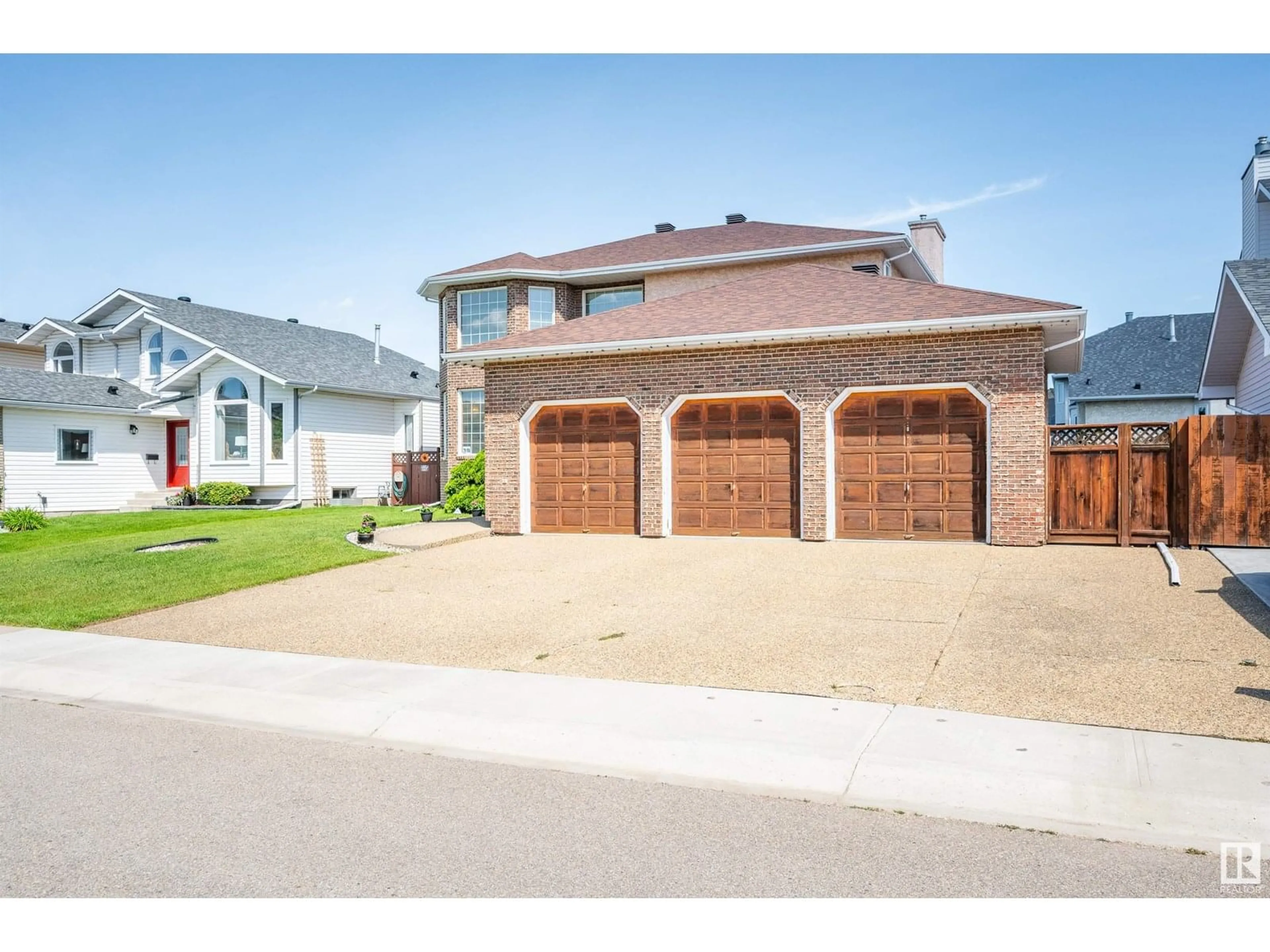 Home with brick exterior material, street for NW - 7408 158 AV, Edmonton Alberta T5Z2Y4