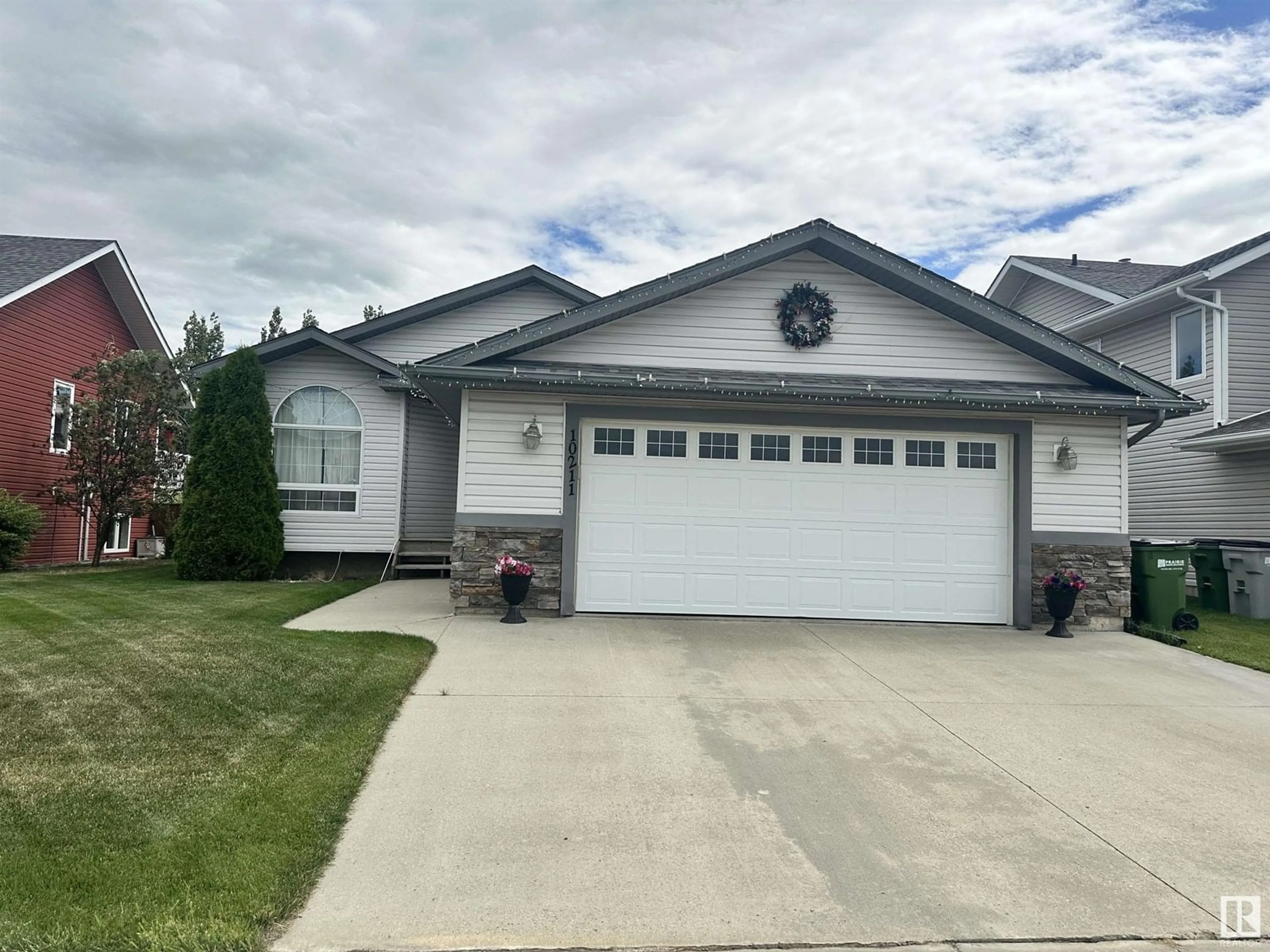 Home with vinyl exterior material, street for 10211 110 AV, Westlock Alberta T7P2S1