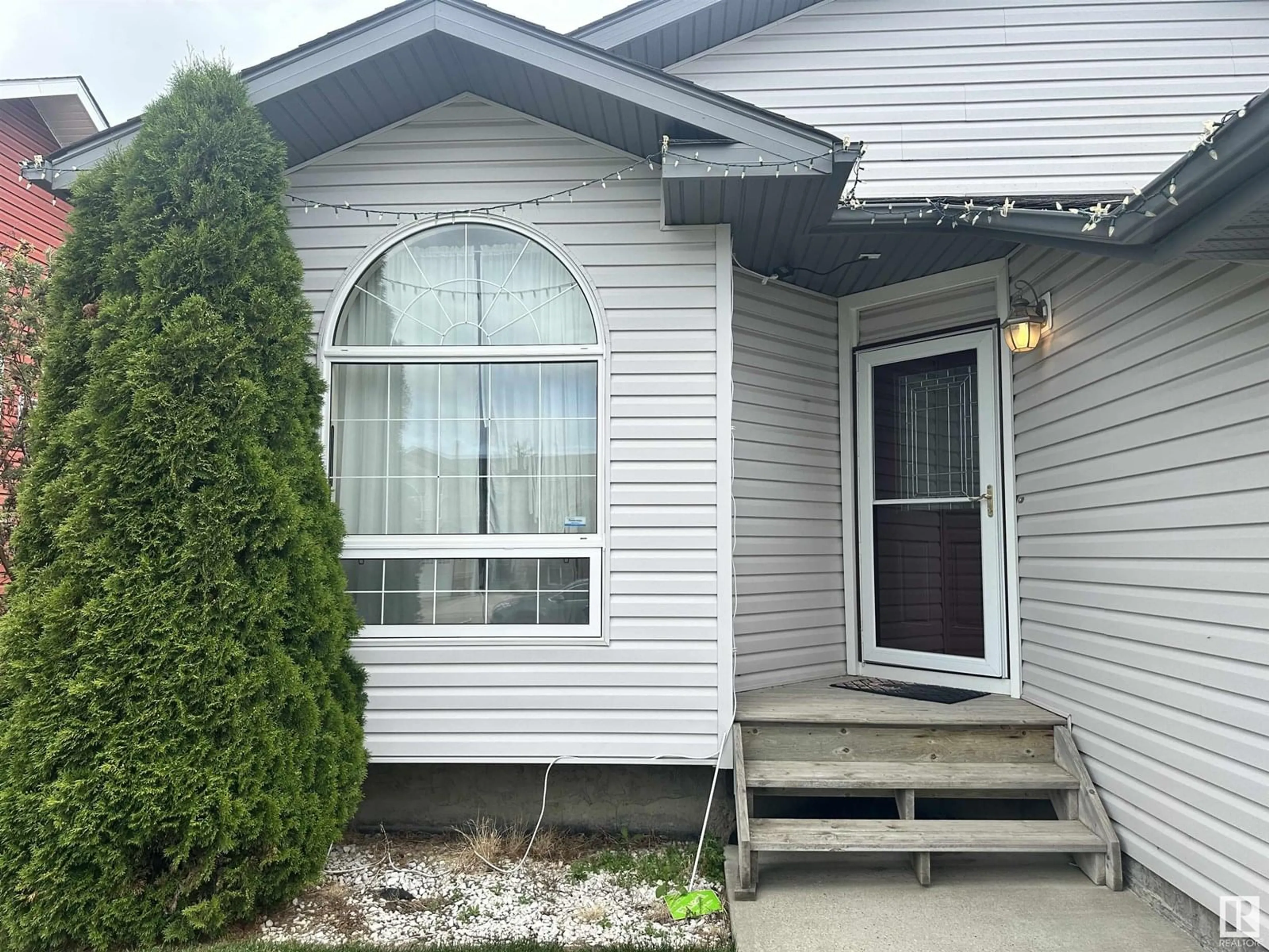 Home with vinyl exterior material, street for 10211 110 AV, Westlock Alberta T7P2S1