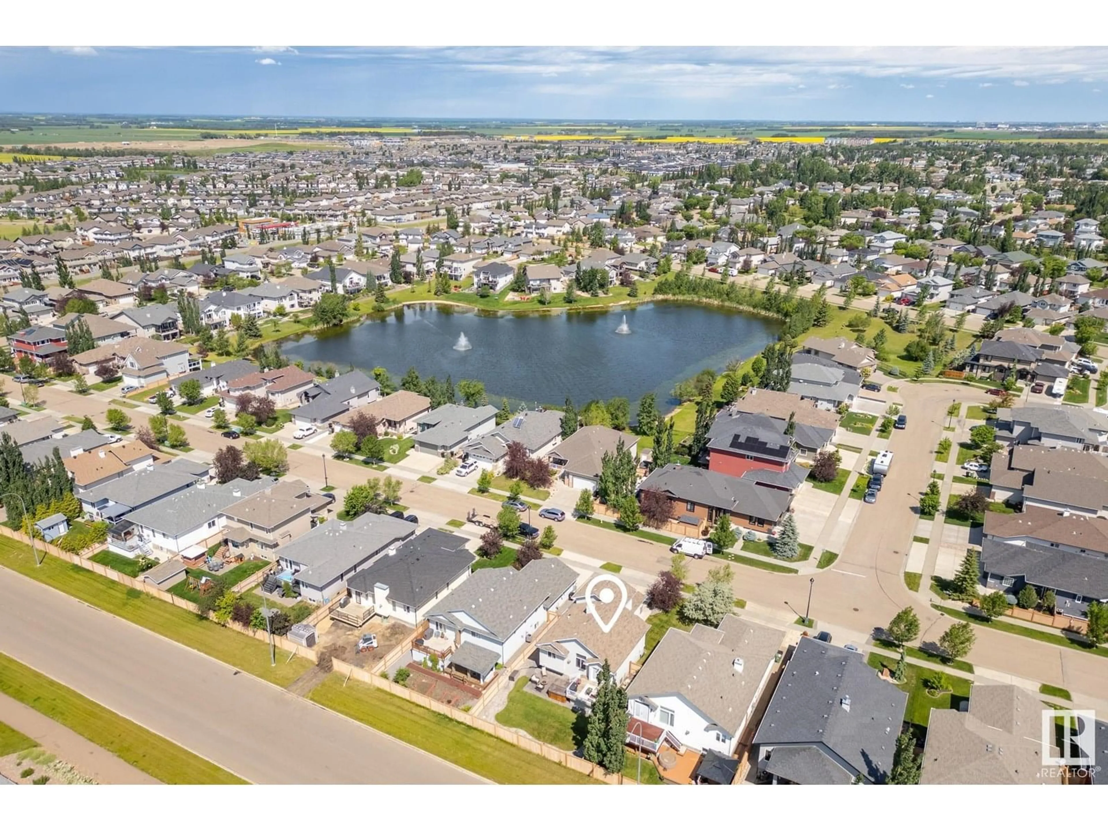 A pic from outside/outdoor area/front of a property/back of a property/a pic from drone, water/lake/river/ocean view for 77 WALTERS PL, Leduc Alberta T9E0G2
