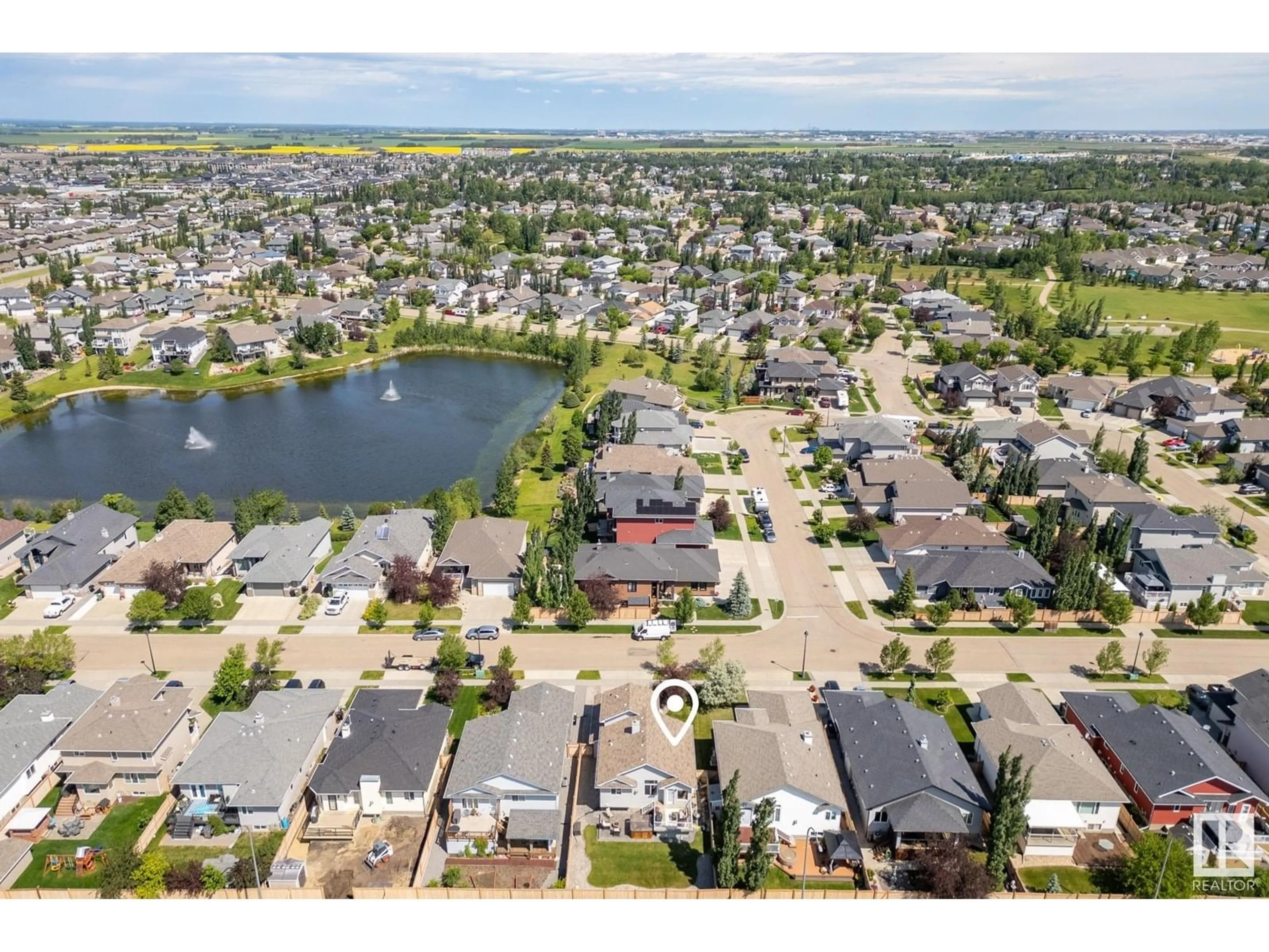 A pic from outside/outdoor area/front of a property/back of a property/a pic from drone, water/lake/river/ocean view for 77 WALTERS PL, Leduc Alberta T9E0G2