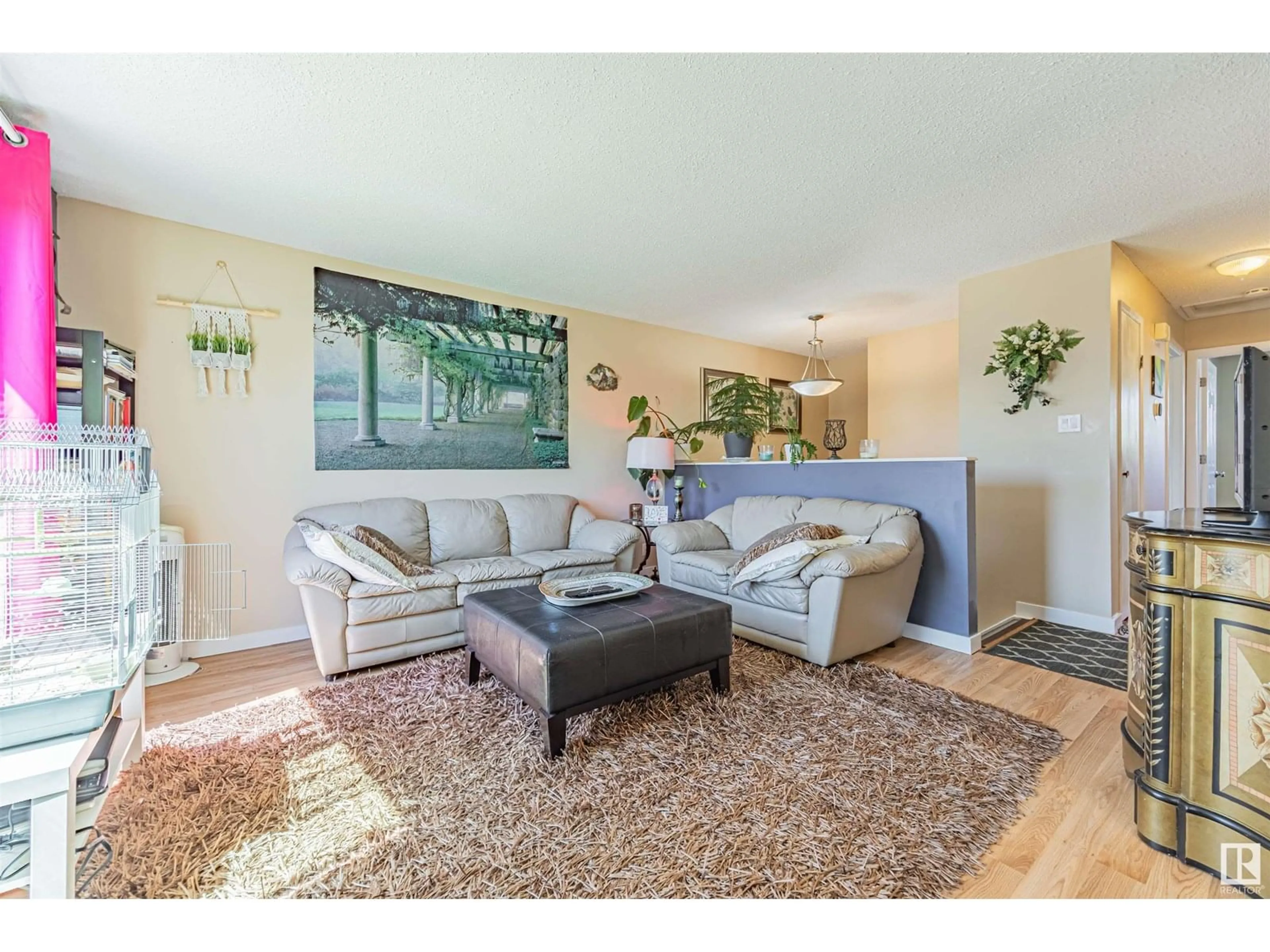 Living room with furniture, wood/laminate floor for N NW - 296 KNOTTWOOD NORTH RD, Edmonton Alberta T6K1Y5