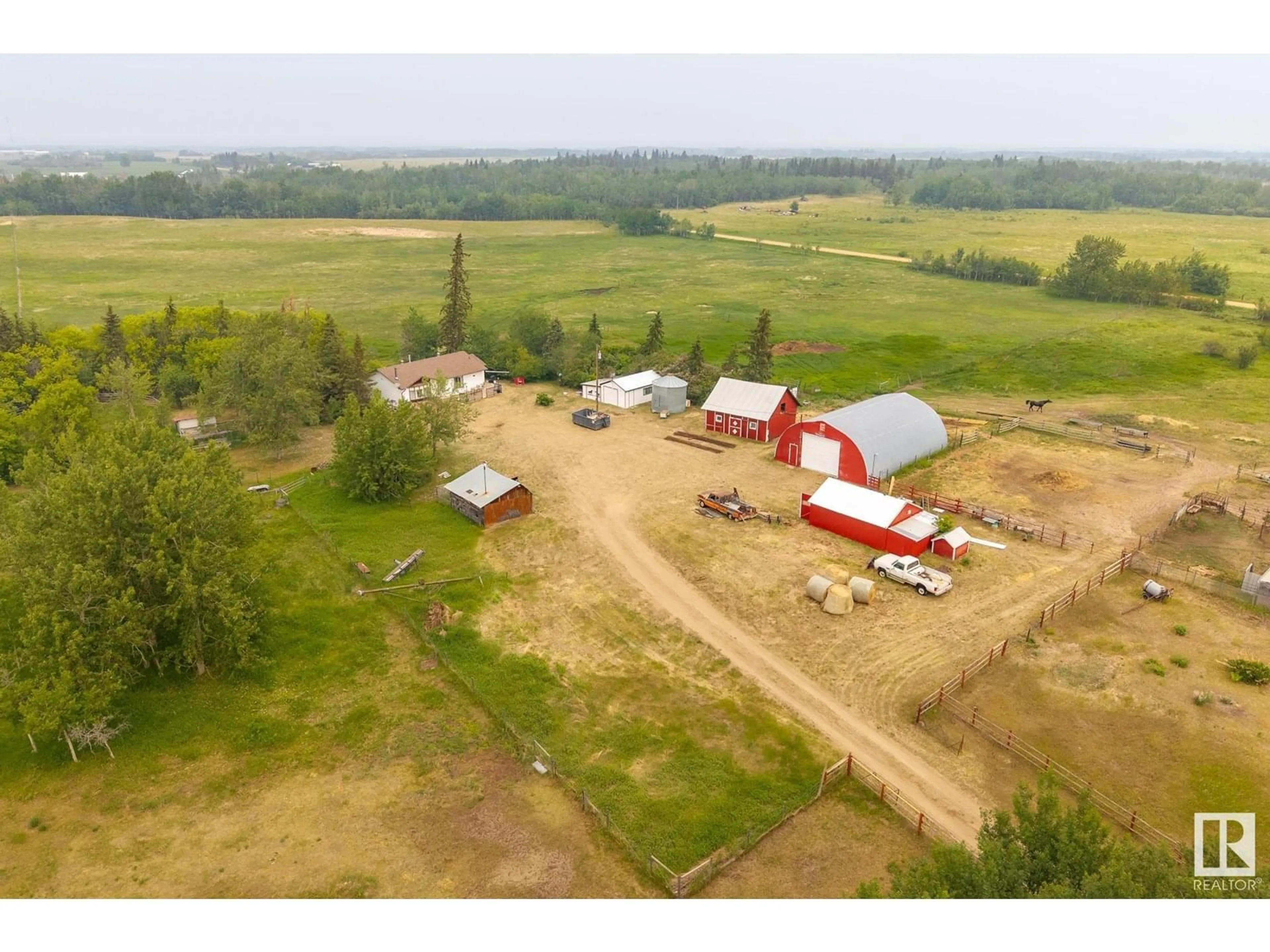A pic from outside/outdoor area/front of a property/back of a property/a pic from drone, building for 22204 TOWNSHIP ROAD 572, Rural Sturgeon County Alberta T0A1N5