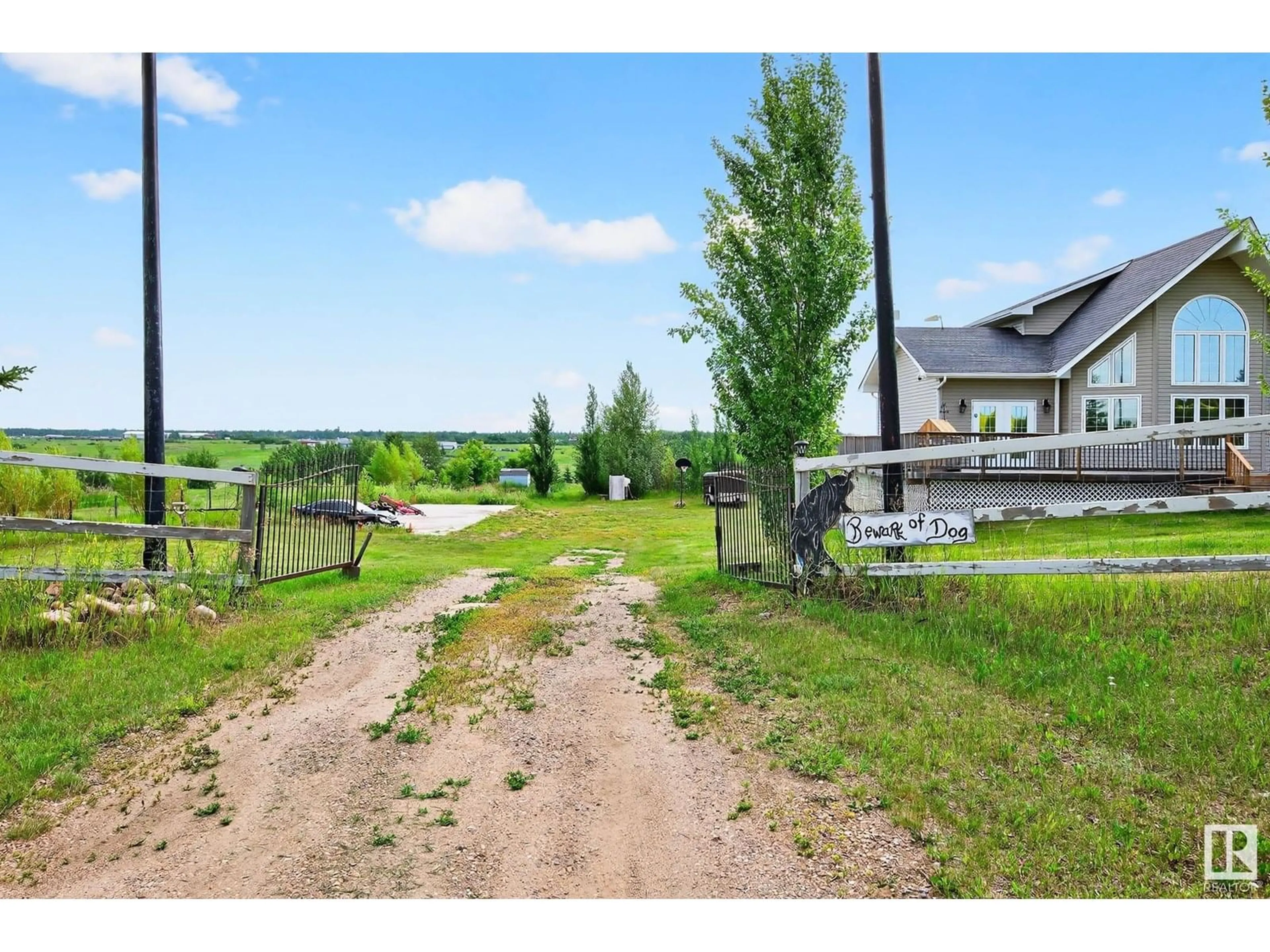 A pic from outside/outdoor area/front of a property/back of a property/a pic from drone, water/lake/river/ocean view for 57517 - 11 LILY LAKE RD, Rural Sturgeon County Alberta T0G1L2