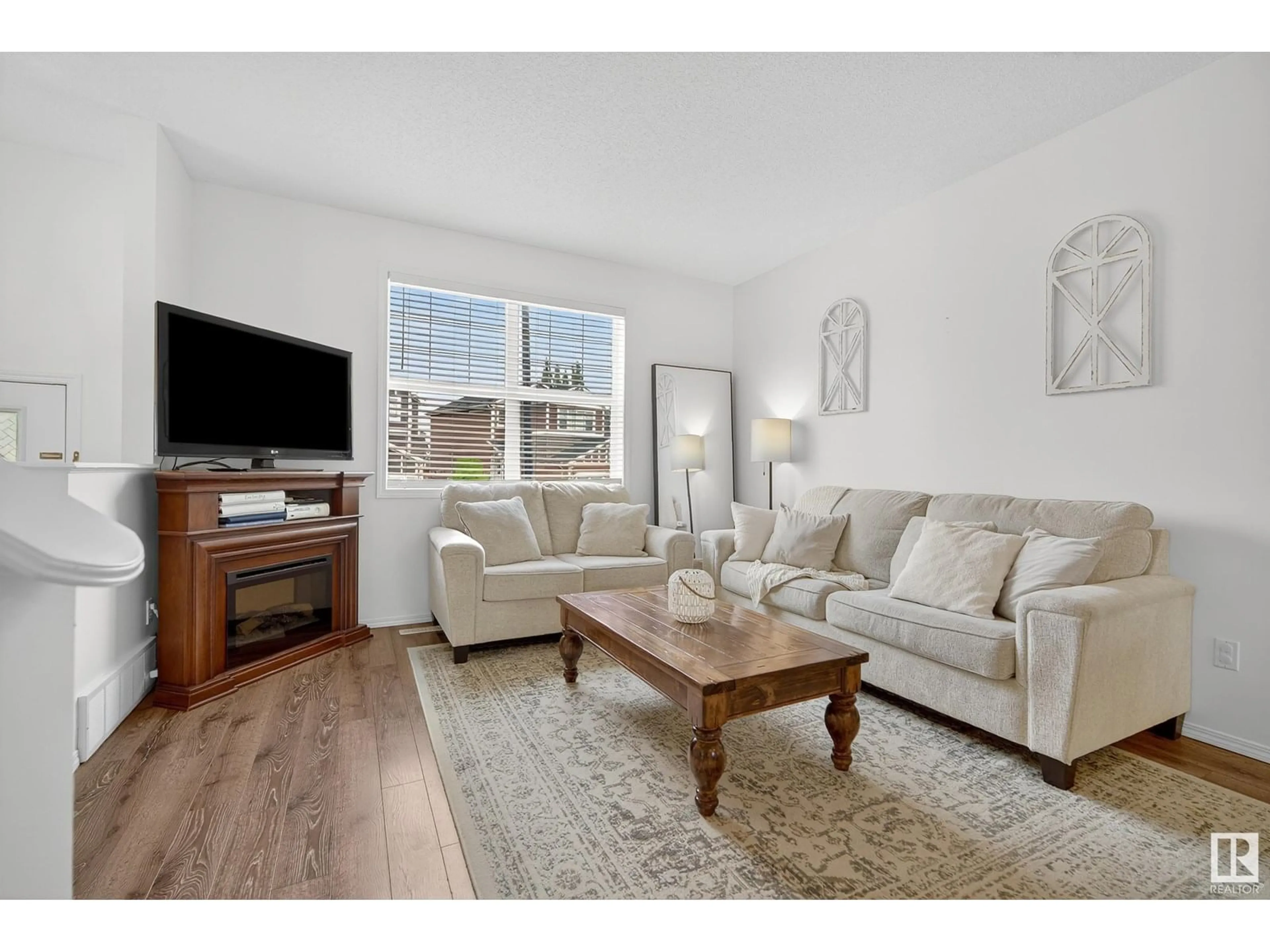 Living room with furniture, wood/laminate floor for 417 SIMPKINS LI, Leduc Alberta T9E1B8