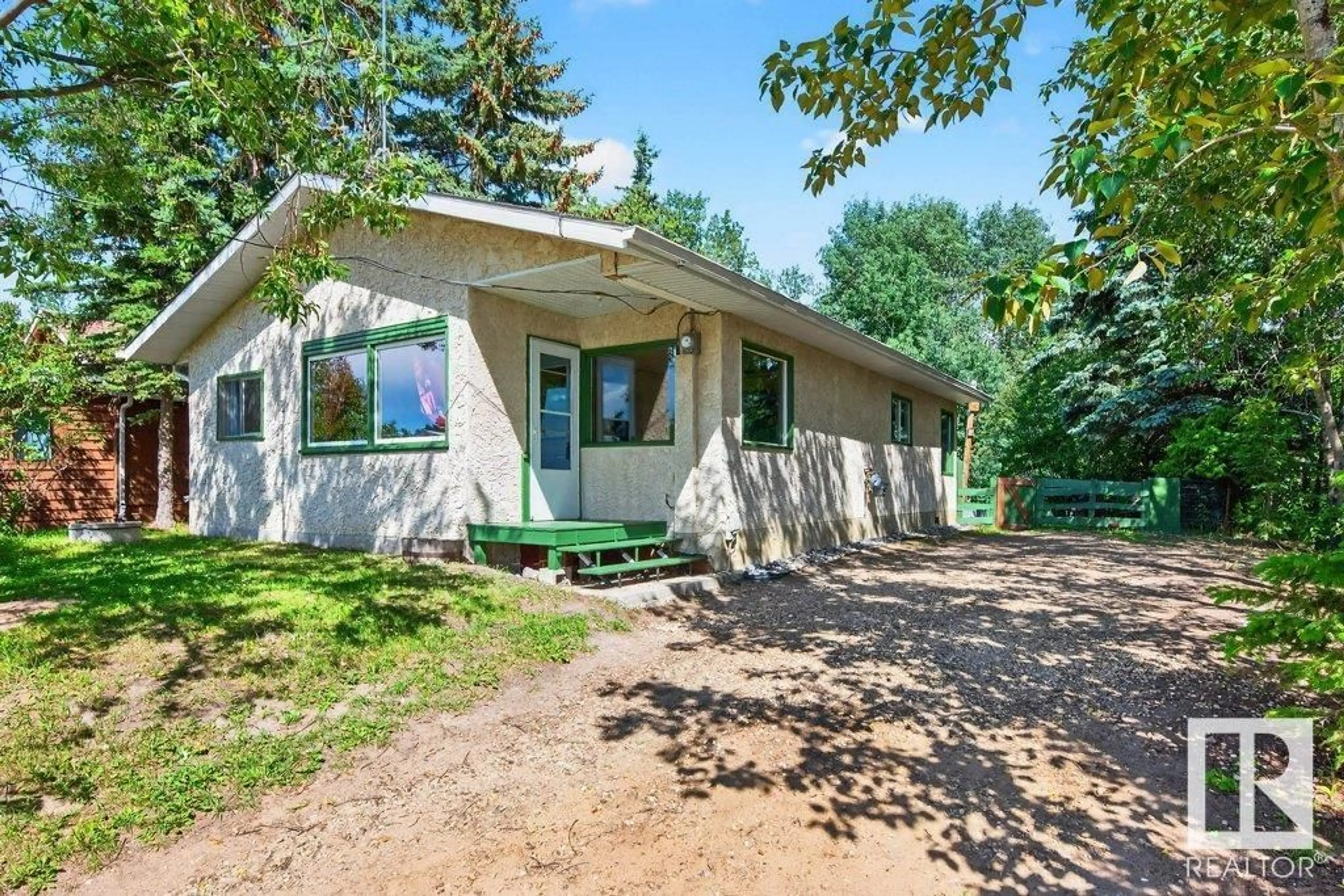 Home with vinyl exterior material, street for #107 - 55022 STE. ANNE TR, Gunn Alberta T0E0E1