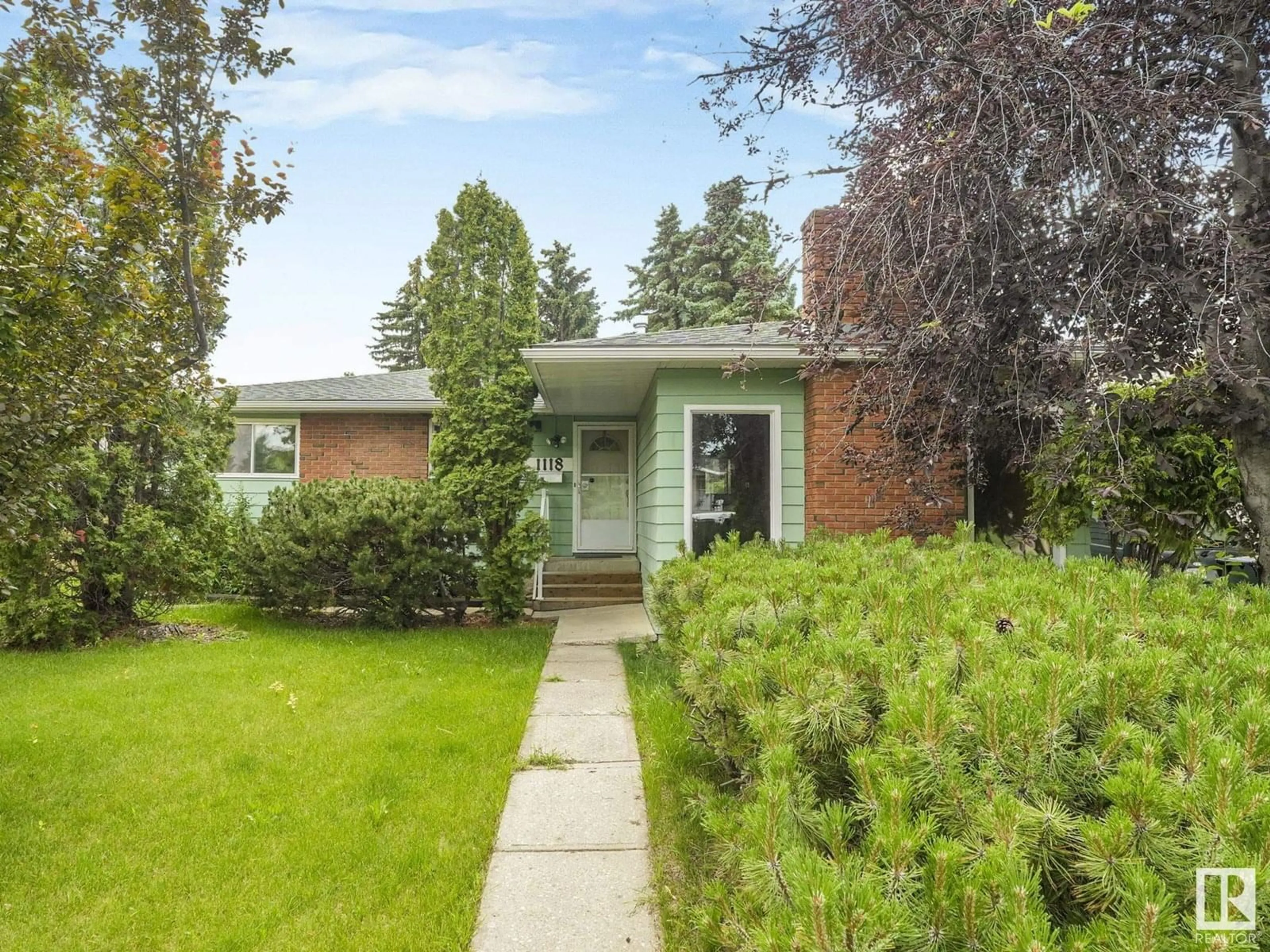 Home with brick exterior material, street for 1118 68 ST, Edmonton Alberta T6K1L1