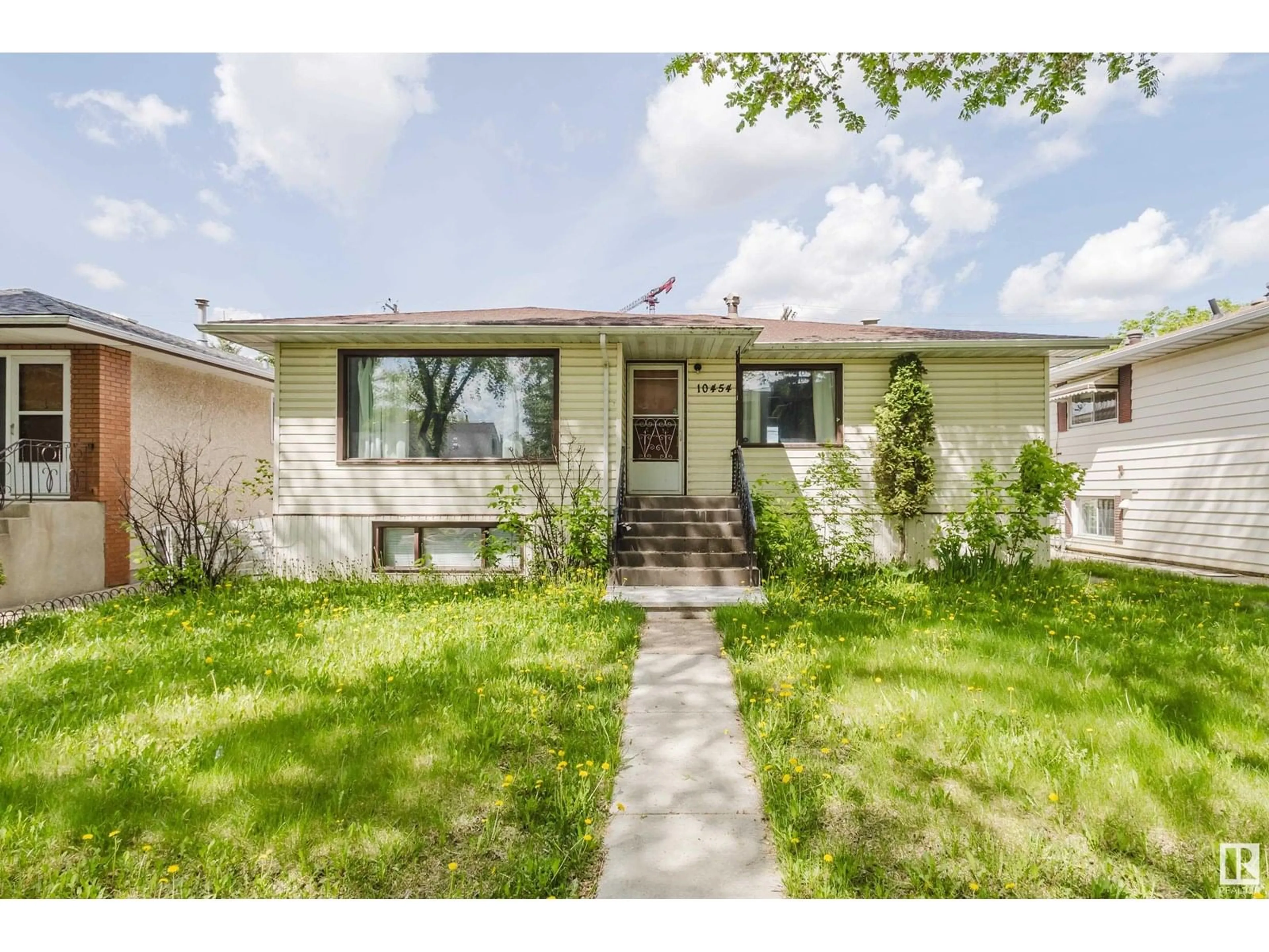 Home with vinyl exterior material, street for 10454 78 AV, Edmonton Alberta T6E1P2