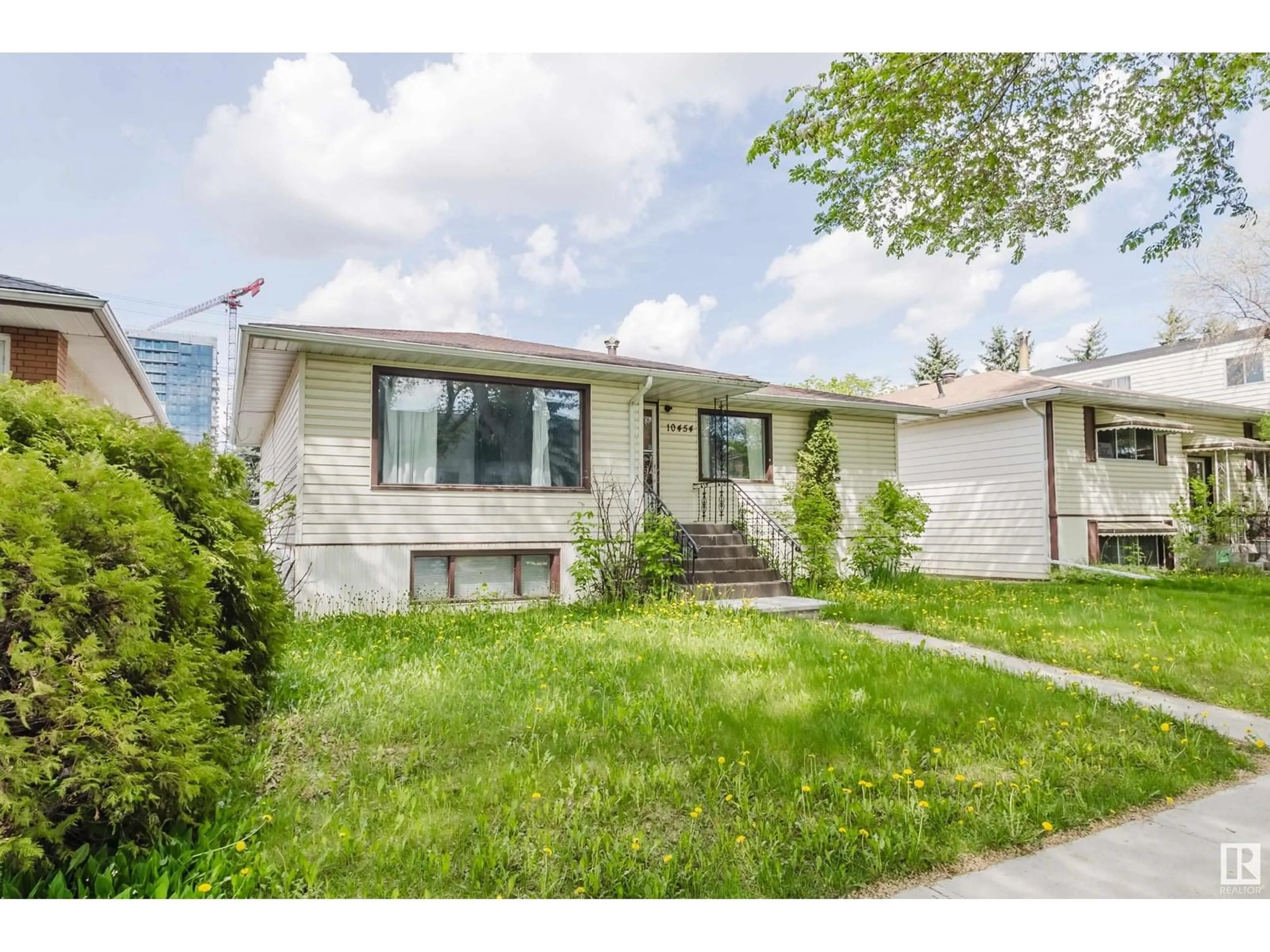 Home with vinyl exterior material, street for 10454 78 AV, Edmonton Alberta T6E1P2