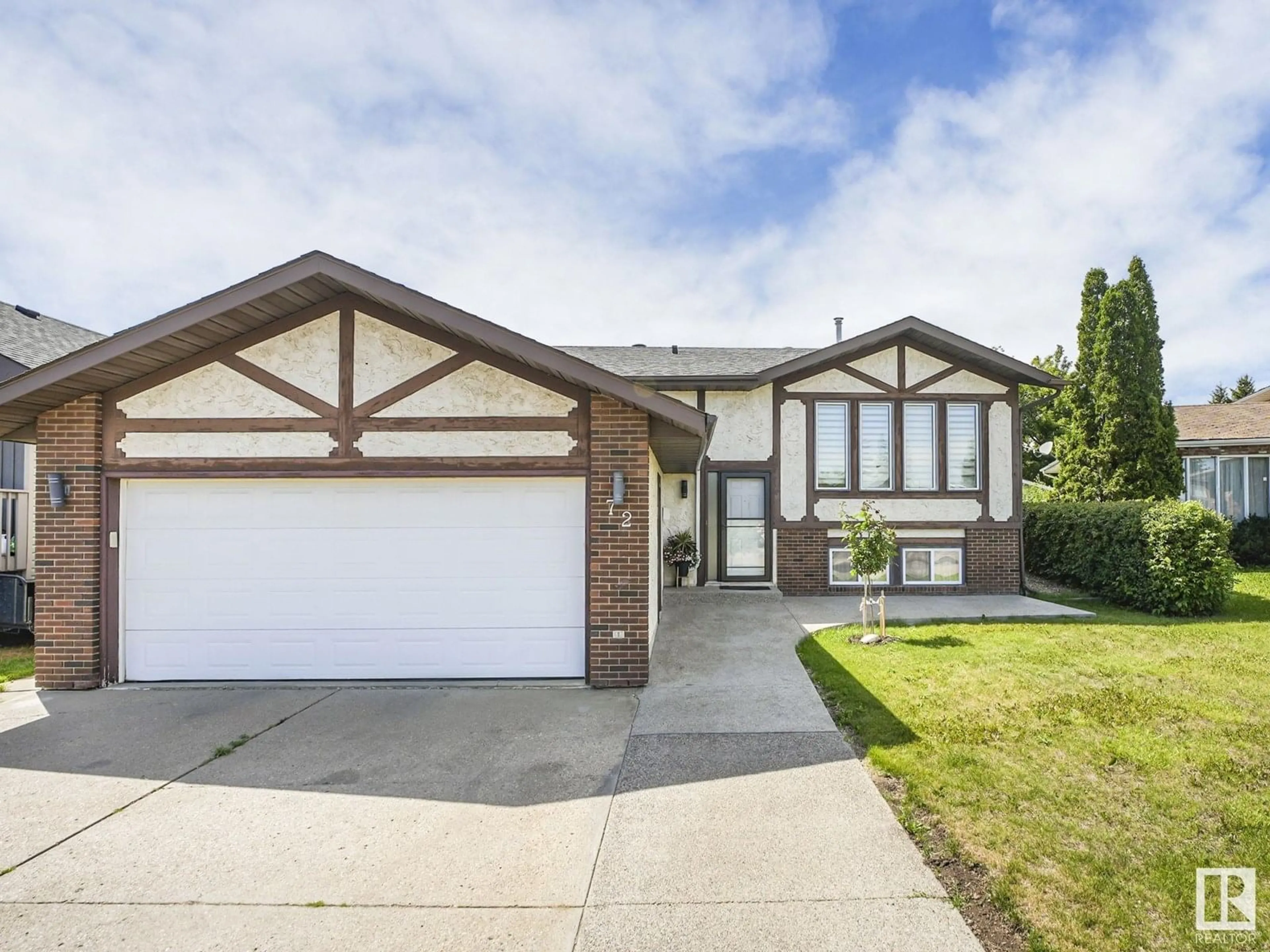 Home with vinyl exterior material, street for 72 DUNLUCE RD, Edmonton Alberta T5X4N9