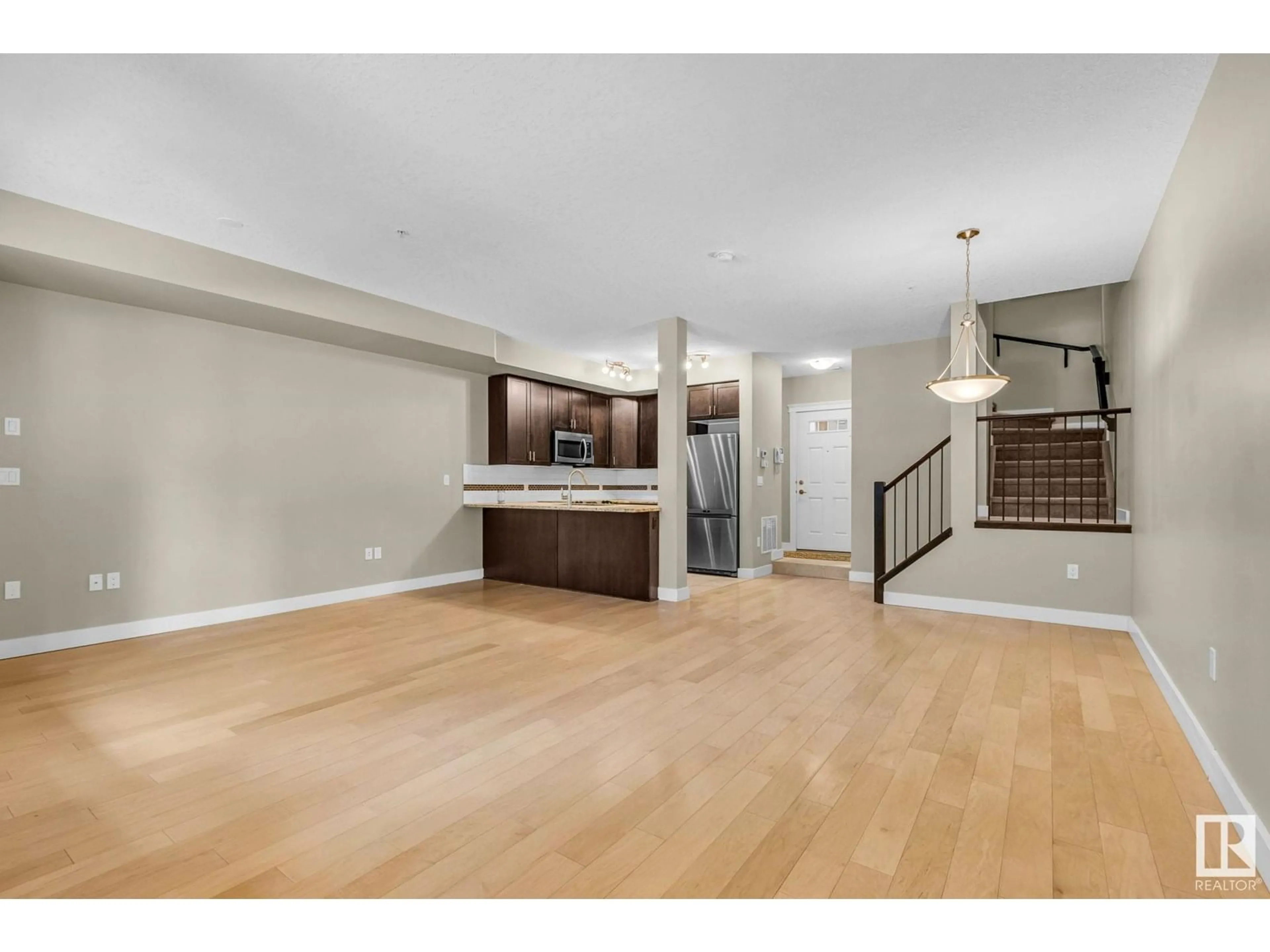 Open concept kitchen, wood/laminate floor for 11518 76 AV, Edmonton Alberta T6G0K7