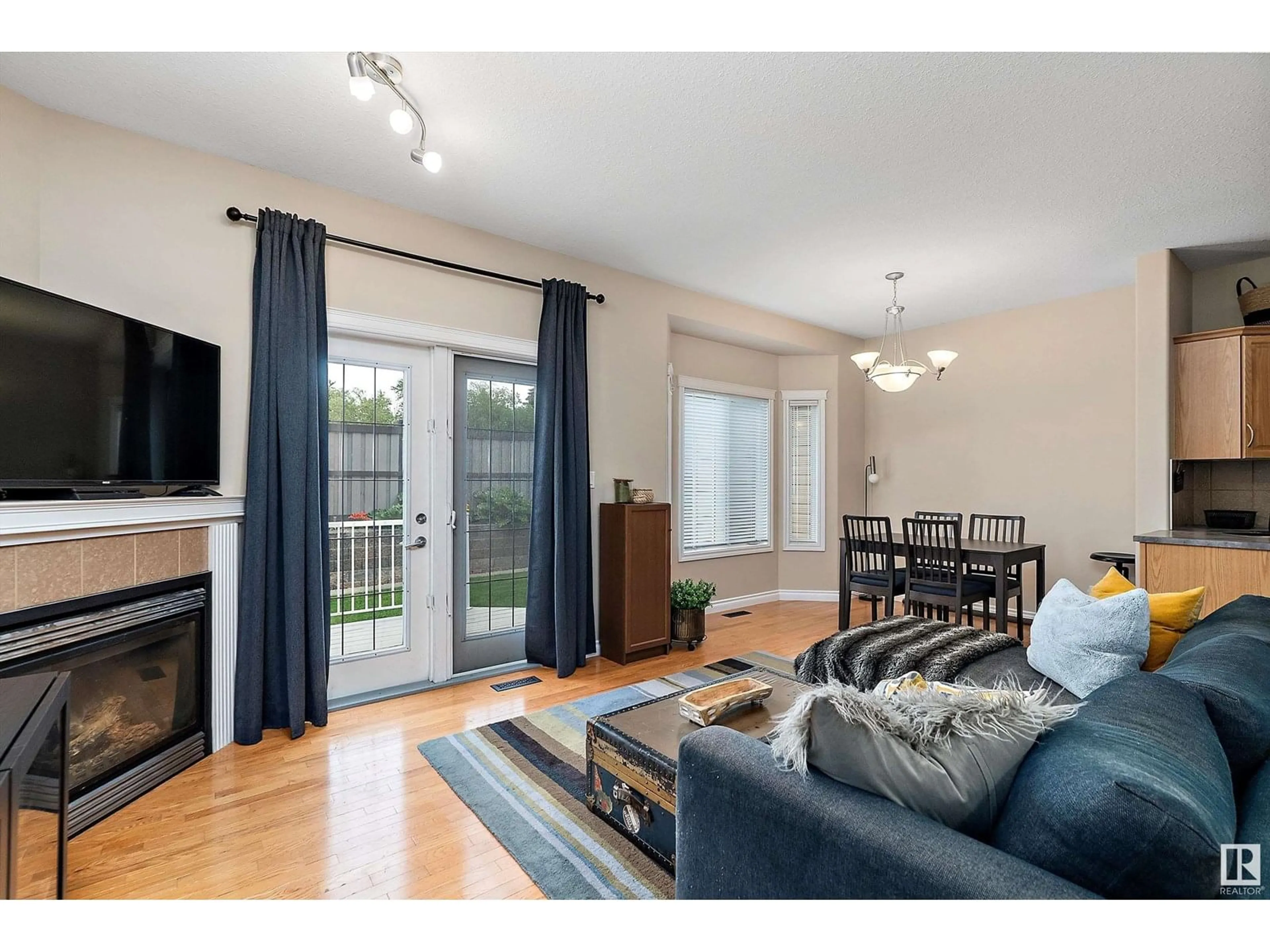 Living room with furniture, wood/laminate floor for #103 - 102 WEST HAVEN DR, Leduc Alberta T9E0A2