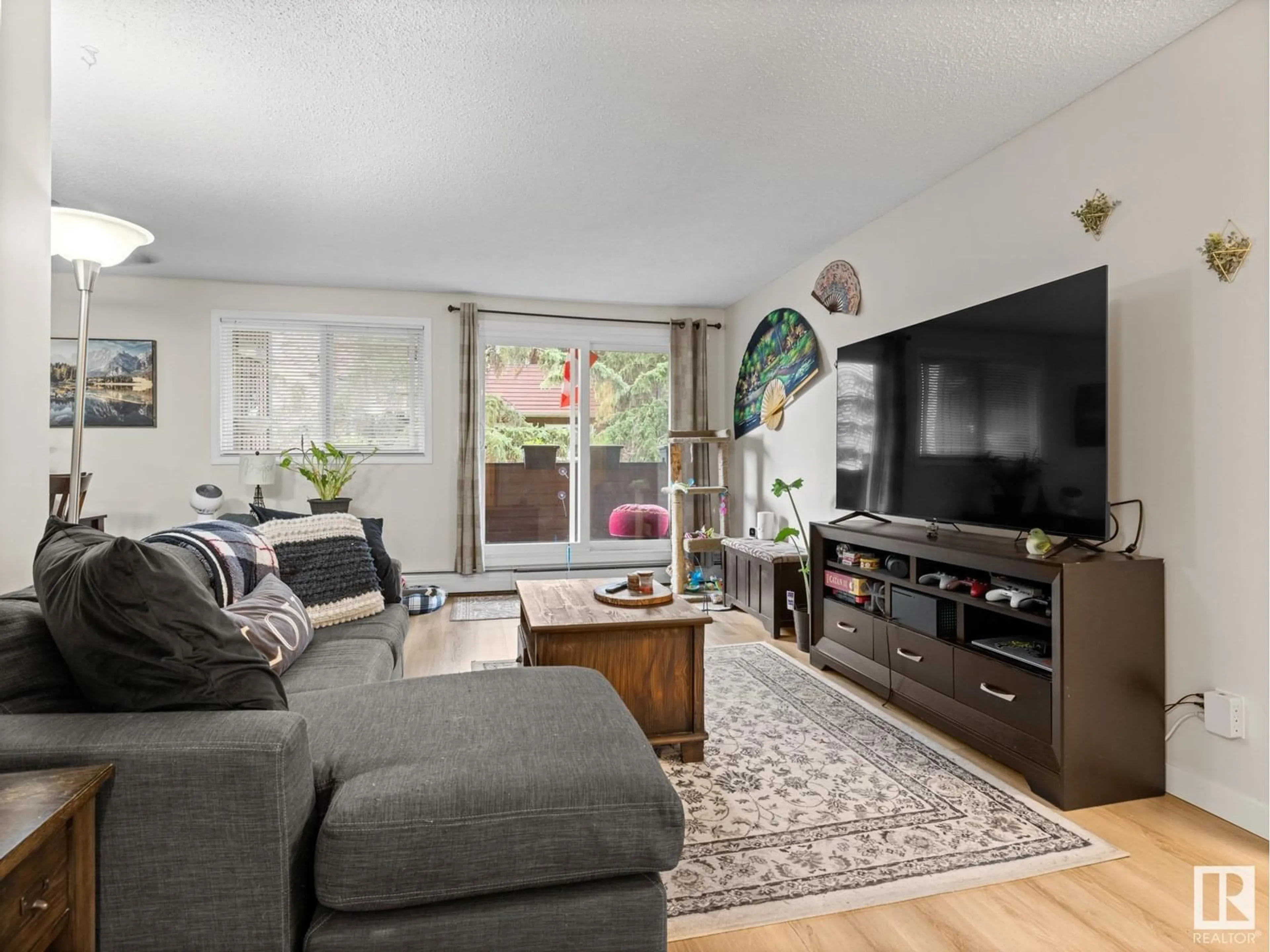 Living room with furniture, unknown for NW - 219 2323 119 ST, Edmonton Alberta T6J4E2