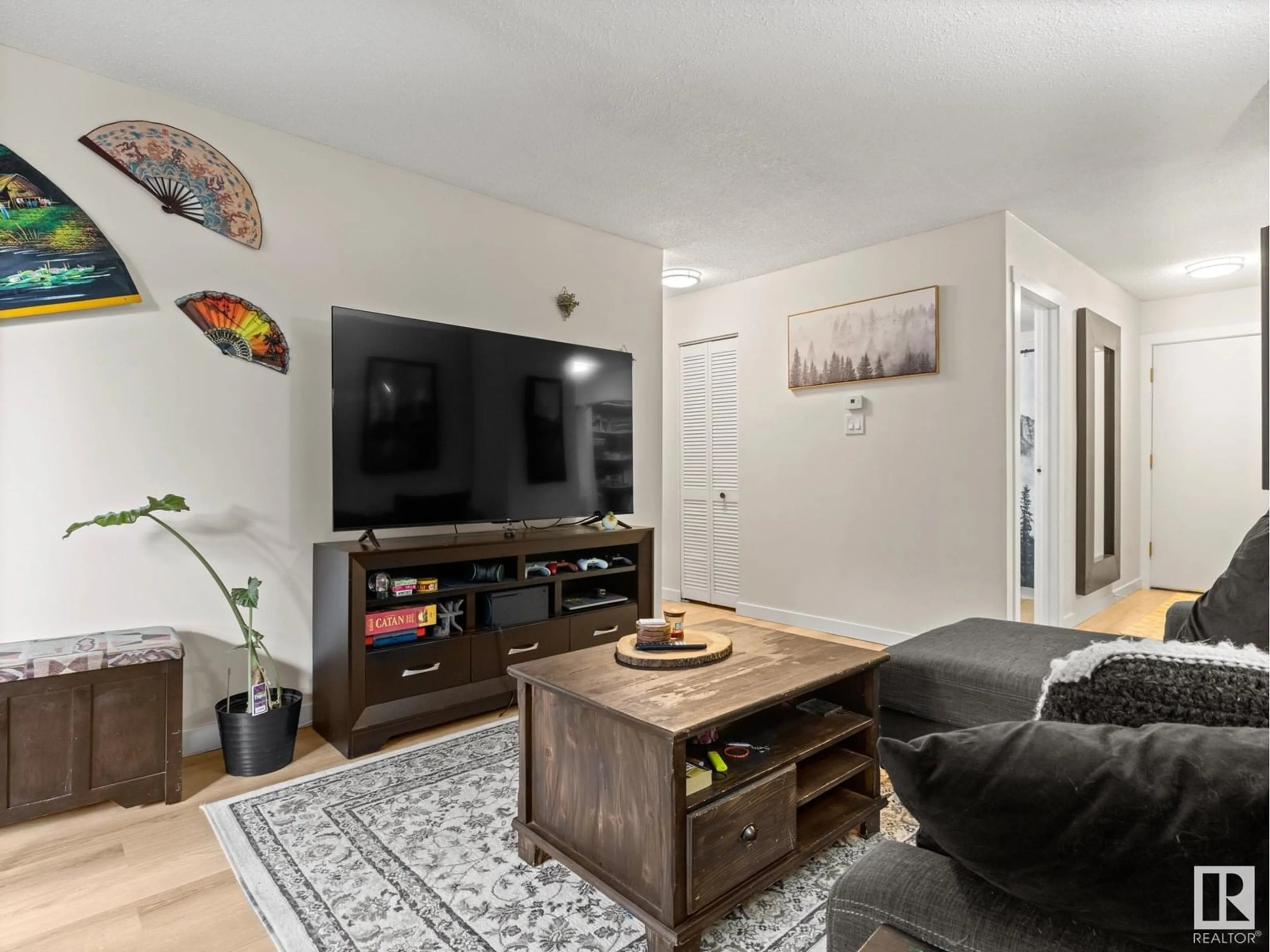 Living room with furniture, unknown for NW - 219 2323 119 ST, Edmonton Alberta T6J4E2