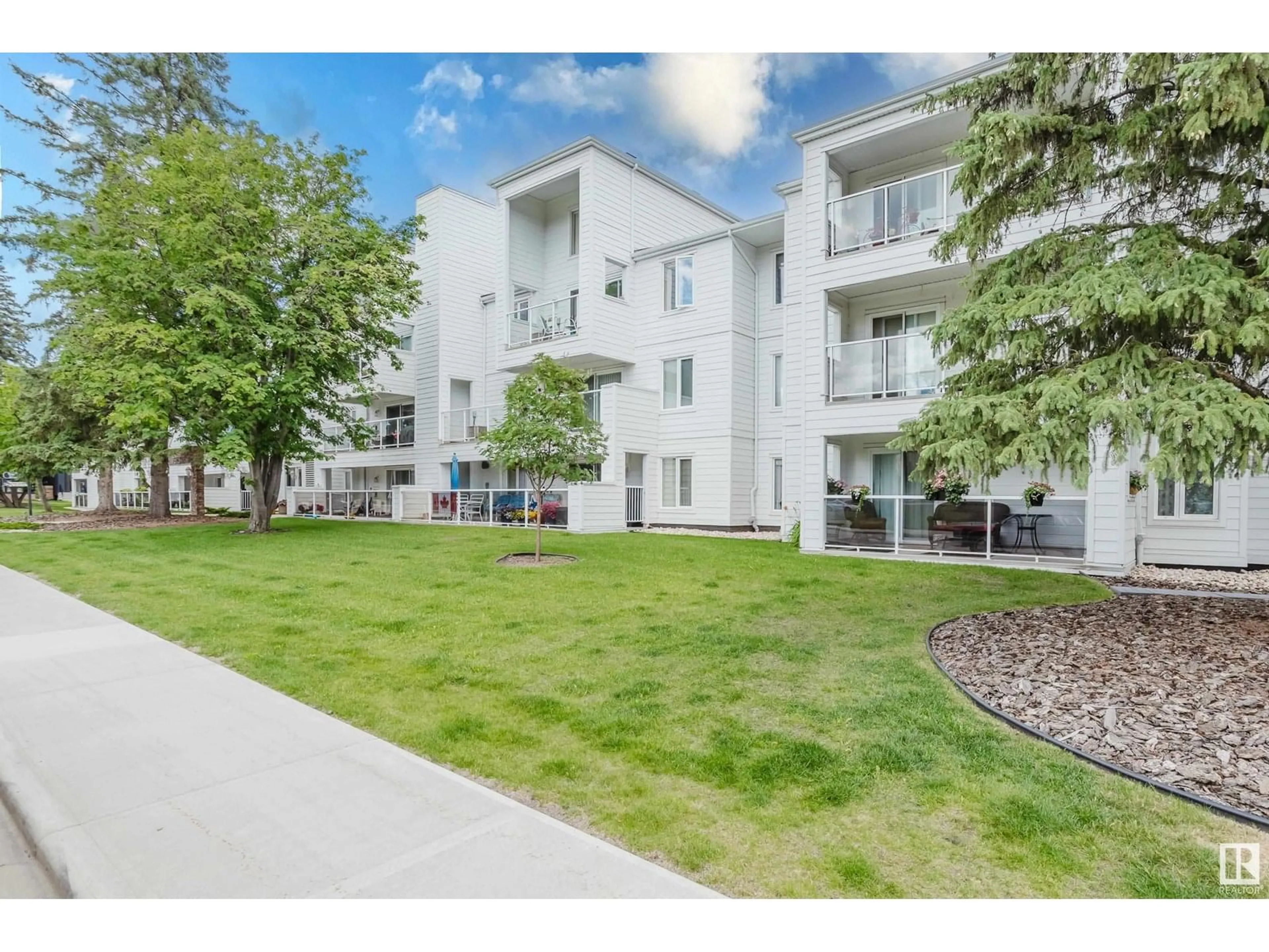 A pic from outside/outdoor area/front of a property/back of a property/a pic from drone, street for #202 - 7327 118 ST NW, Edmonton Alberta T6G1S5