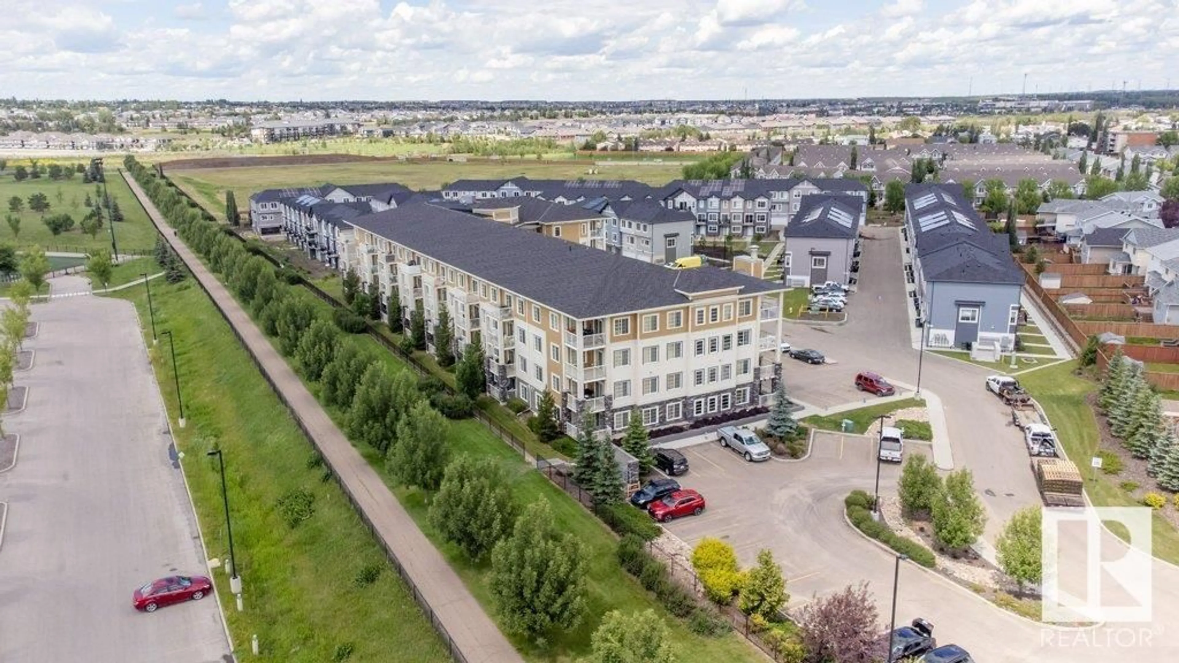 A pic from outside/outdoor area/front of a property/back of a property/a pic from drone, building for 207 - 3670 139 AV, Edmonton Alberta T5Y3N5