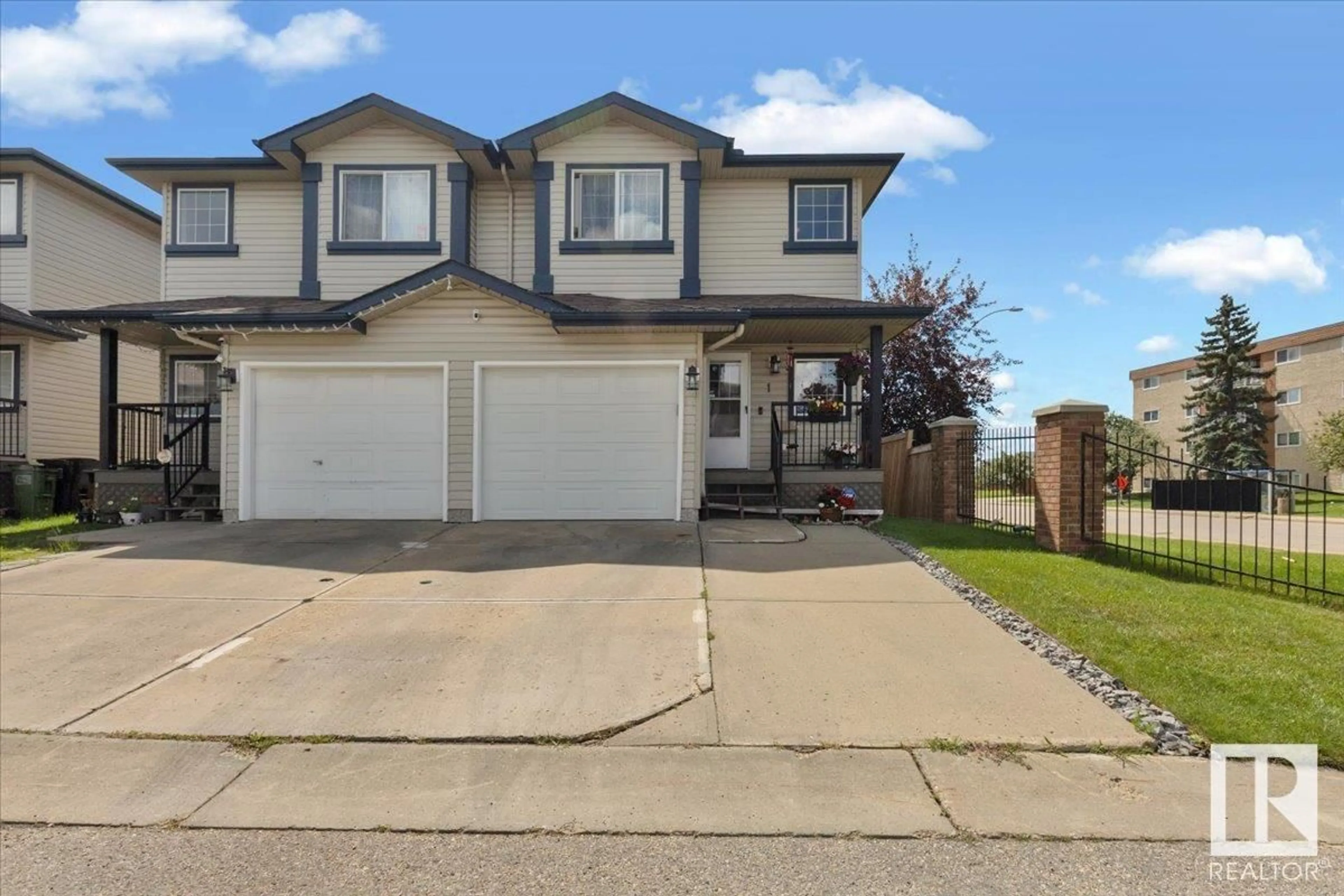Home with vinyl exterior material, street for 345 KIRKNESS RD, Edmonton Alberta T5Y2M7