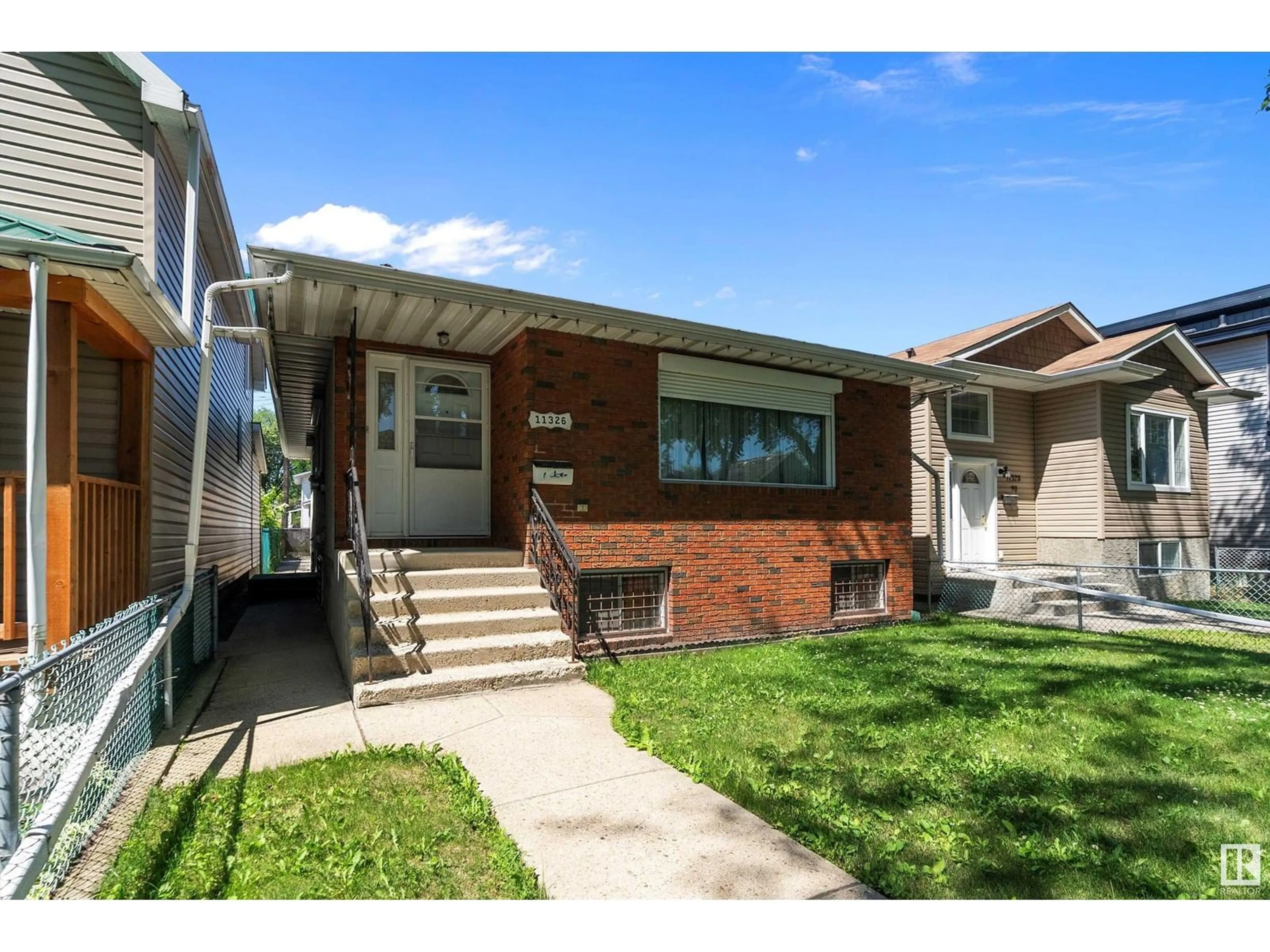 Home with brick exterior material, street for NW - 11326 90 ST, Edmonton Alberta T5B3X5