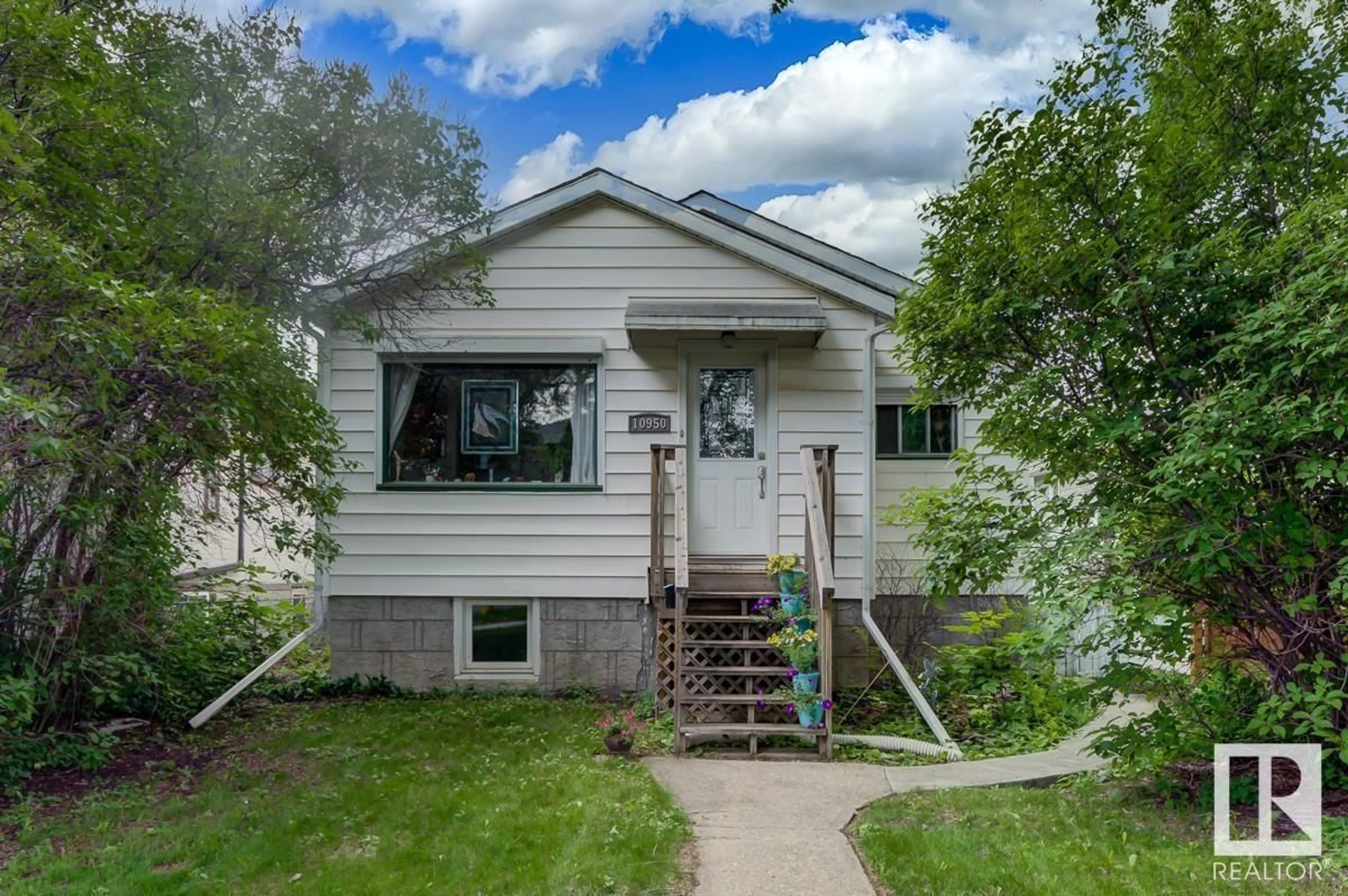 Home with vinyl exterior material, street for NW - 10950 73 AV, Edmonton Alberta T6G0C2