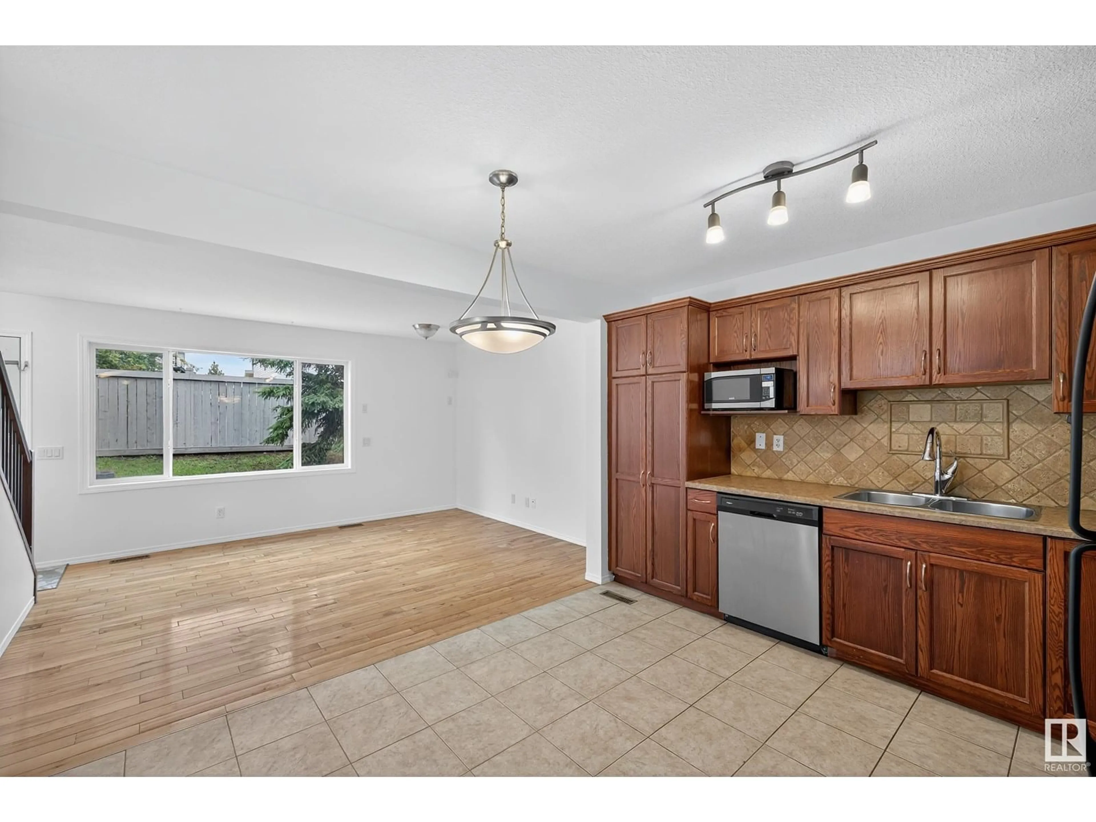 Open concept kitchen, unknown for #12 - 2816 34 AV, Edmonton Alberta T6T2B4