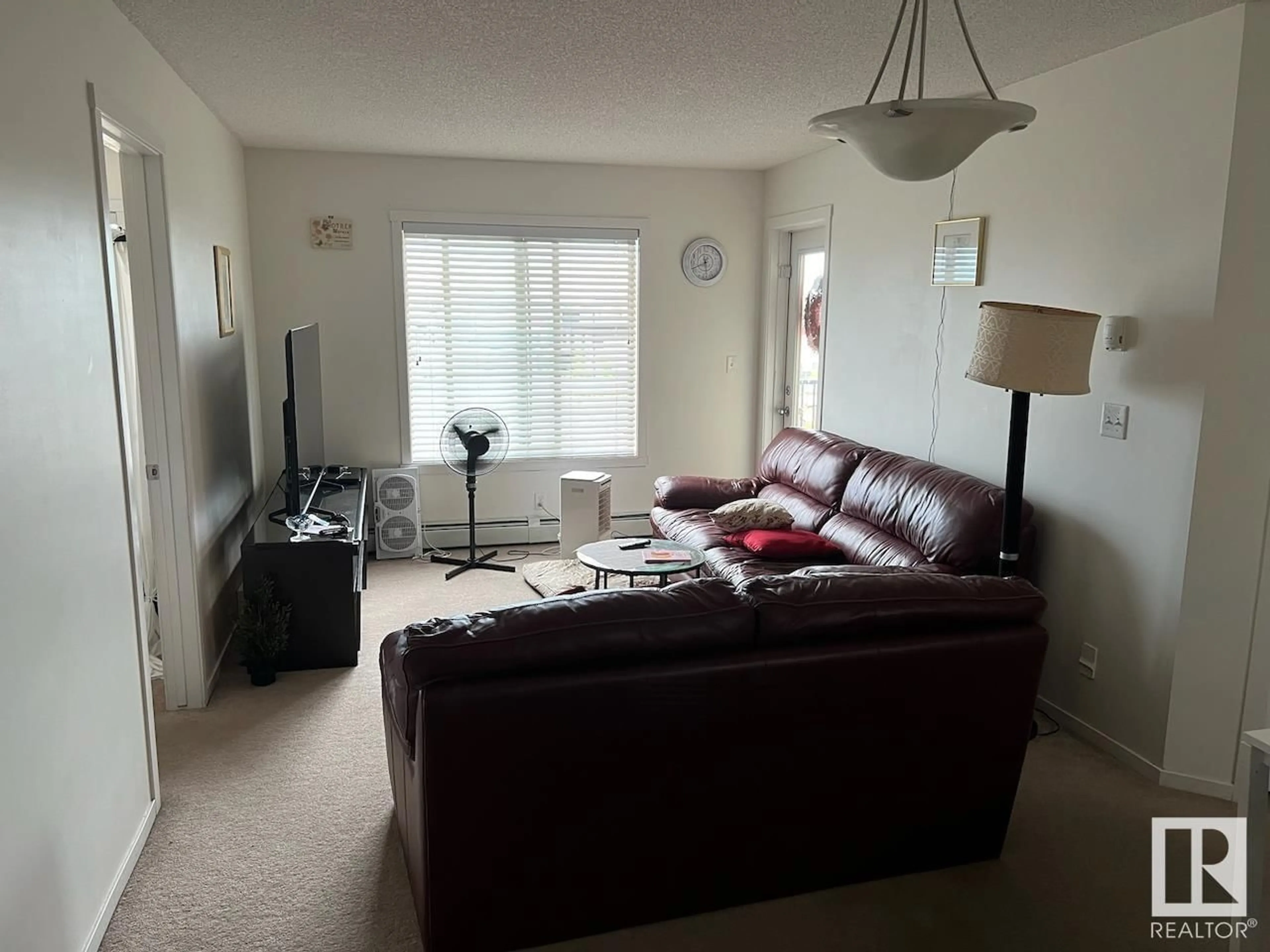 Living room with furniture, unknown for 403 - 5810 MULLEN PL, Edmonton Alberta T6R0W3