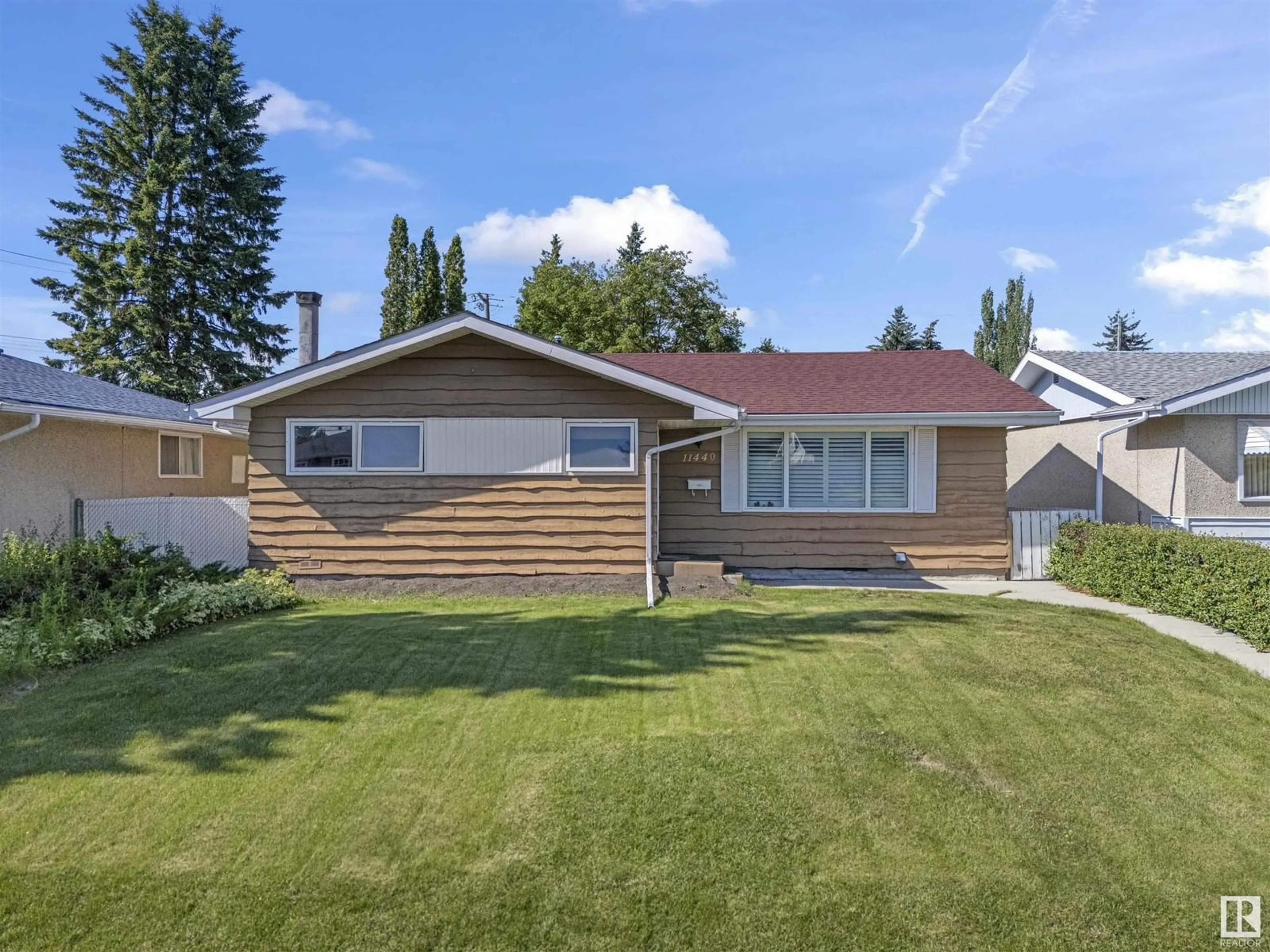 Home with vinyl exterior material, street for 11440 MALMO RD, Edmonton Alberta T6H4M2